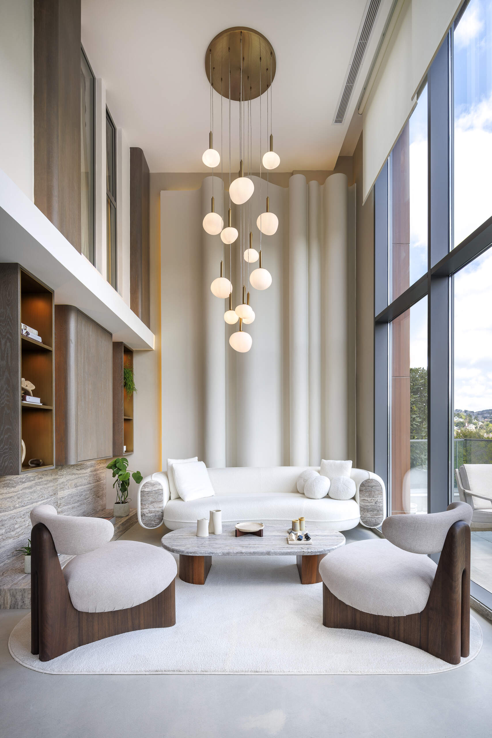 A balanced interior of a loft apartment, where contrast becomes harmony, blending softness, sculpture, structure, light, and natural materials into one cohesive space.