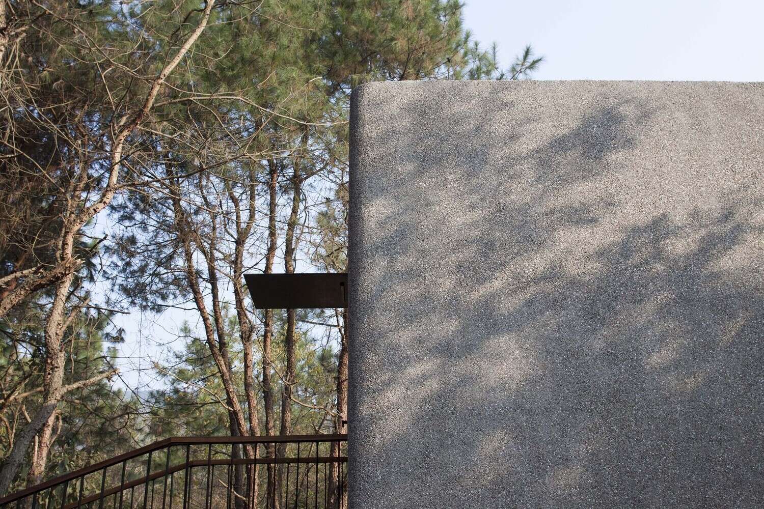 Raised above the ground and accessed by exterior stairs, this cabin minimizes impact while creating a simple, elevated entry experience.