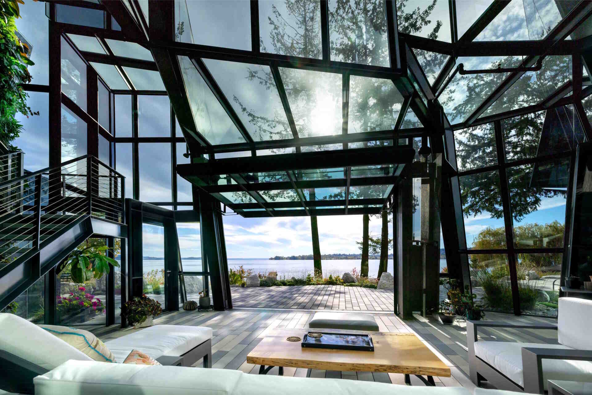 A futuristic glass home in Kirkland, Washington transforms a crystal-inspired idea into reality, with angular forms, reflective surfaces, and uninterrupted views across Lake Washington.