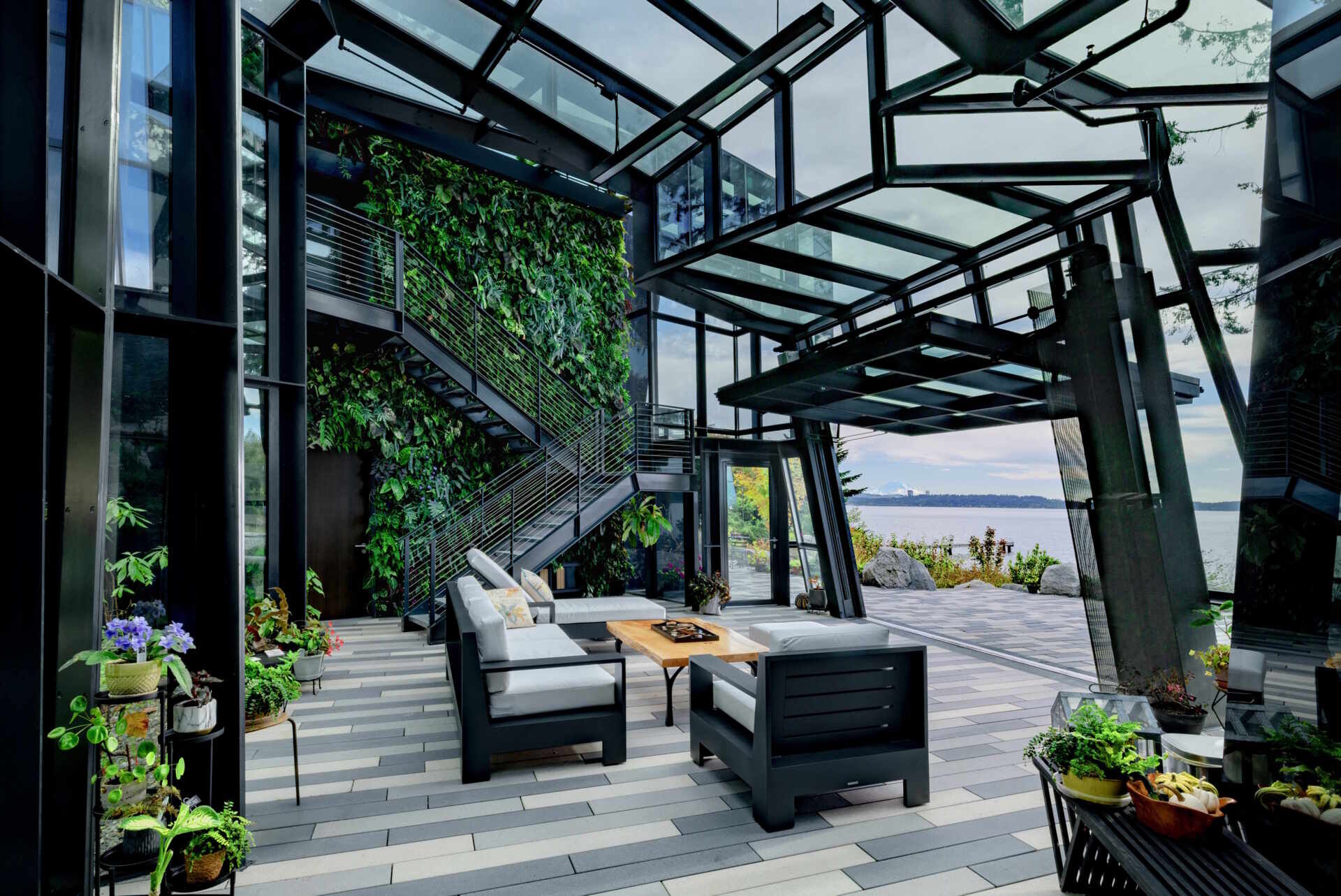 A futuristic glass home in Kirkland, Washington transforms a crystal-inspired idea into reality, with angular forms, reflective surfaces, and uninterrupted views across Lake Washington.