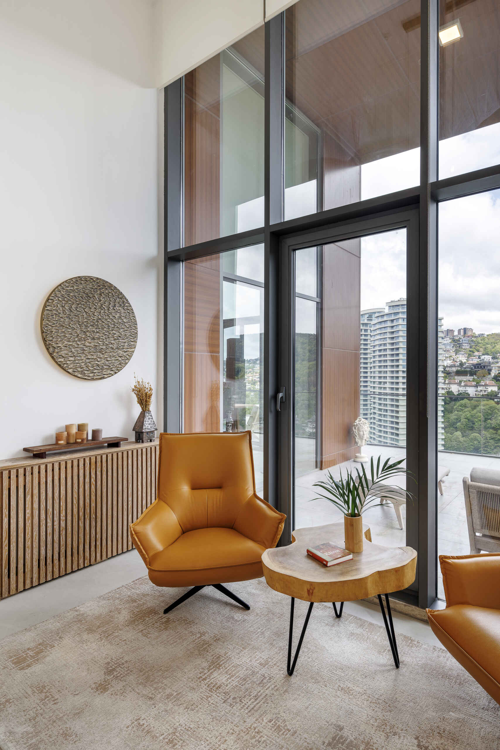 Custom furniture, layered scents, and curated objects transform this loft into a fully immersive interior experience.