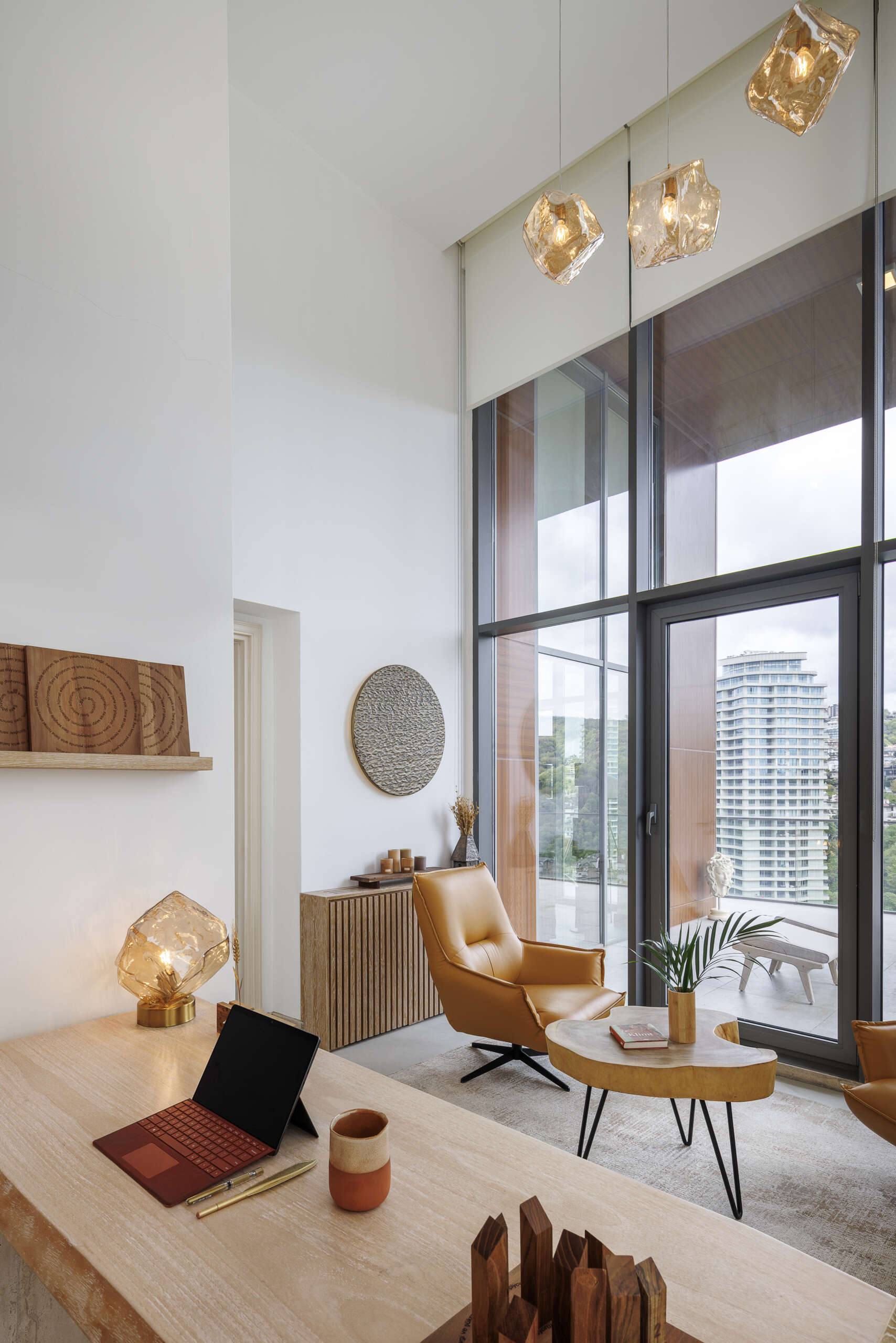 Custom furniture, layered scents, and curated objects transform this loft into a fully immersive interior experience.