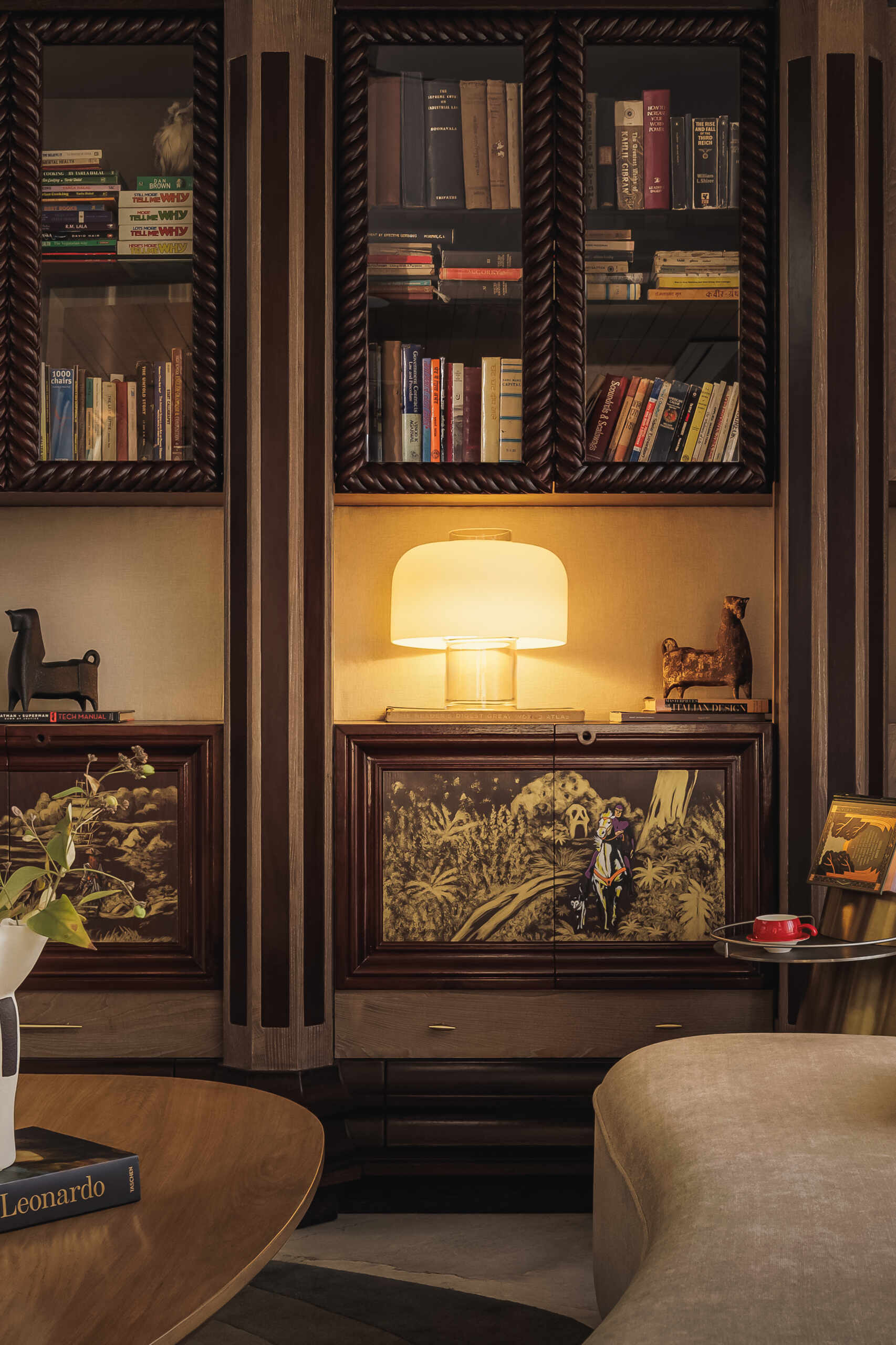 The library, located below the den, feels like a place that will evolve over time, especially as objects, books, and collected pieces fill the shelves.