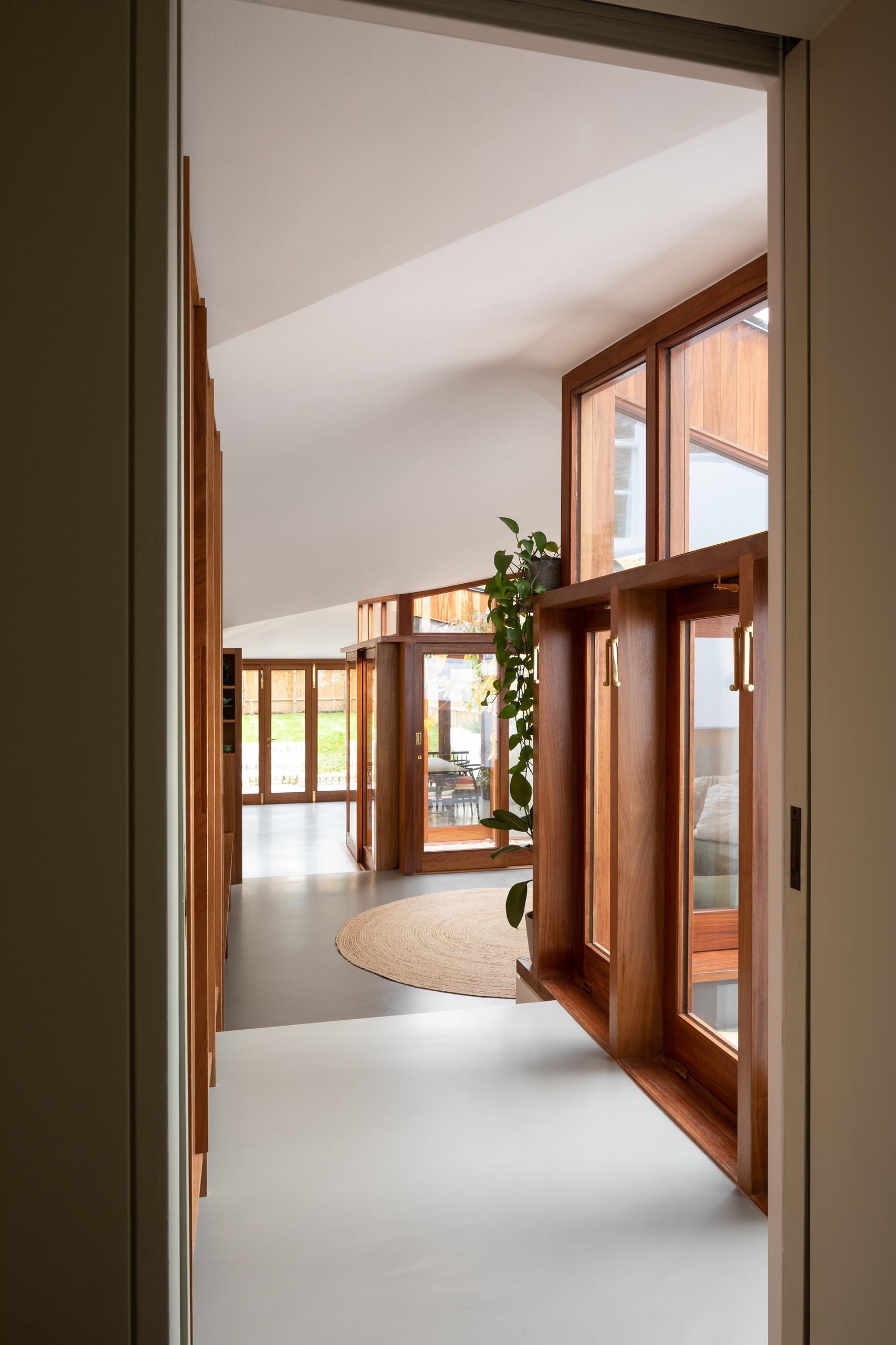 Thick wood window frames add warmth and texture to this clean, modern interior.