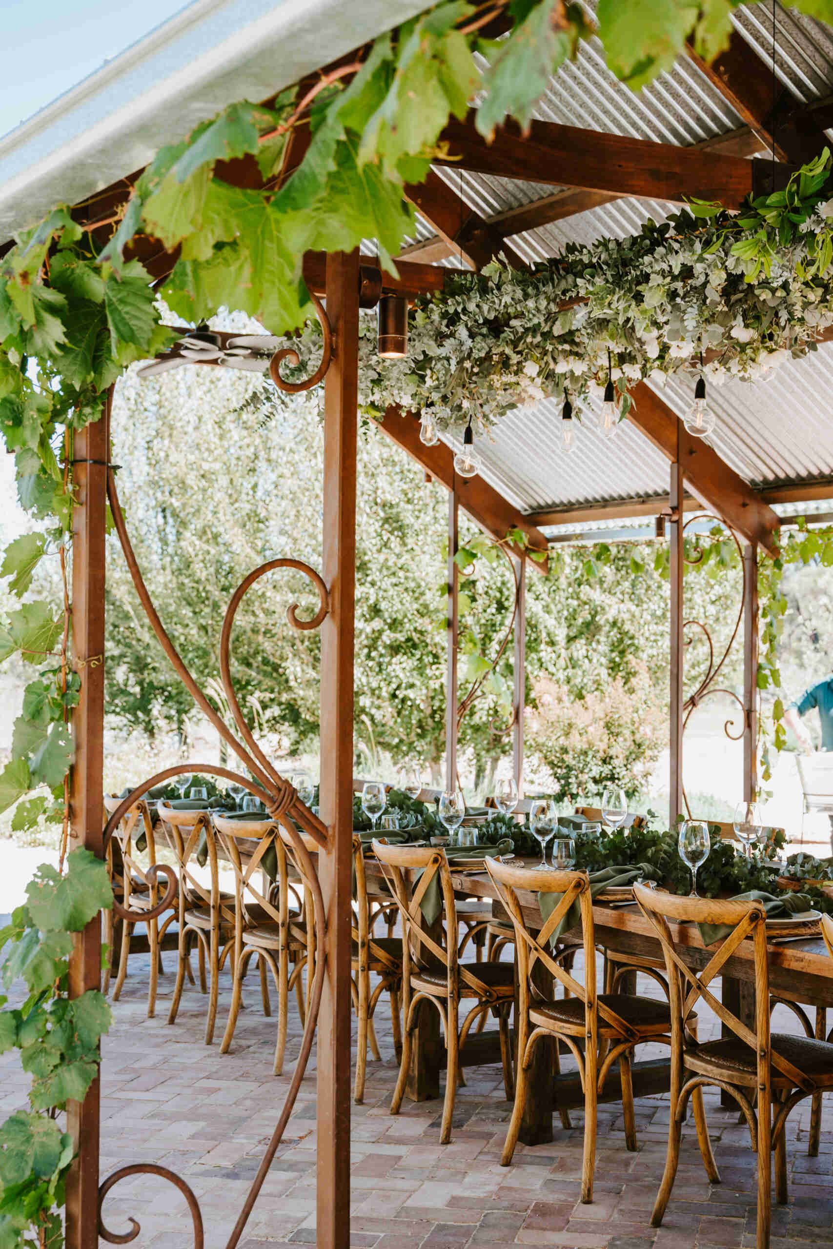 An intimate open-air events space in Australia where rammed earth, timber, and fire create a relaxed setting for gatherings and long-table dining.