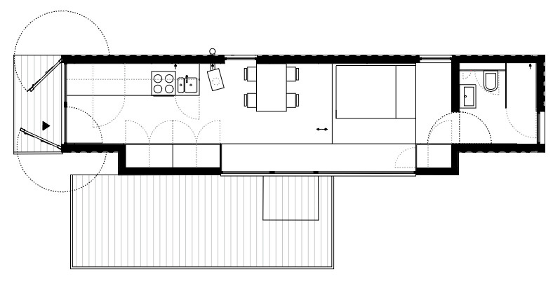 Offroadhouse in Wrzeszczyn, Poland transforms a recycled shipping container into a minimalist forest cabin with a raw industrial exterior, large deck, and peaceful natural setting beside water and dense vegetation.