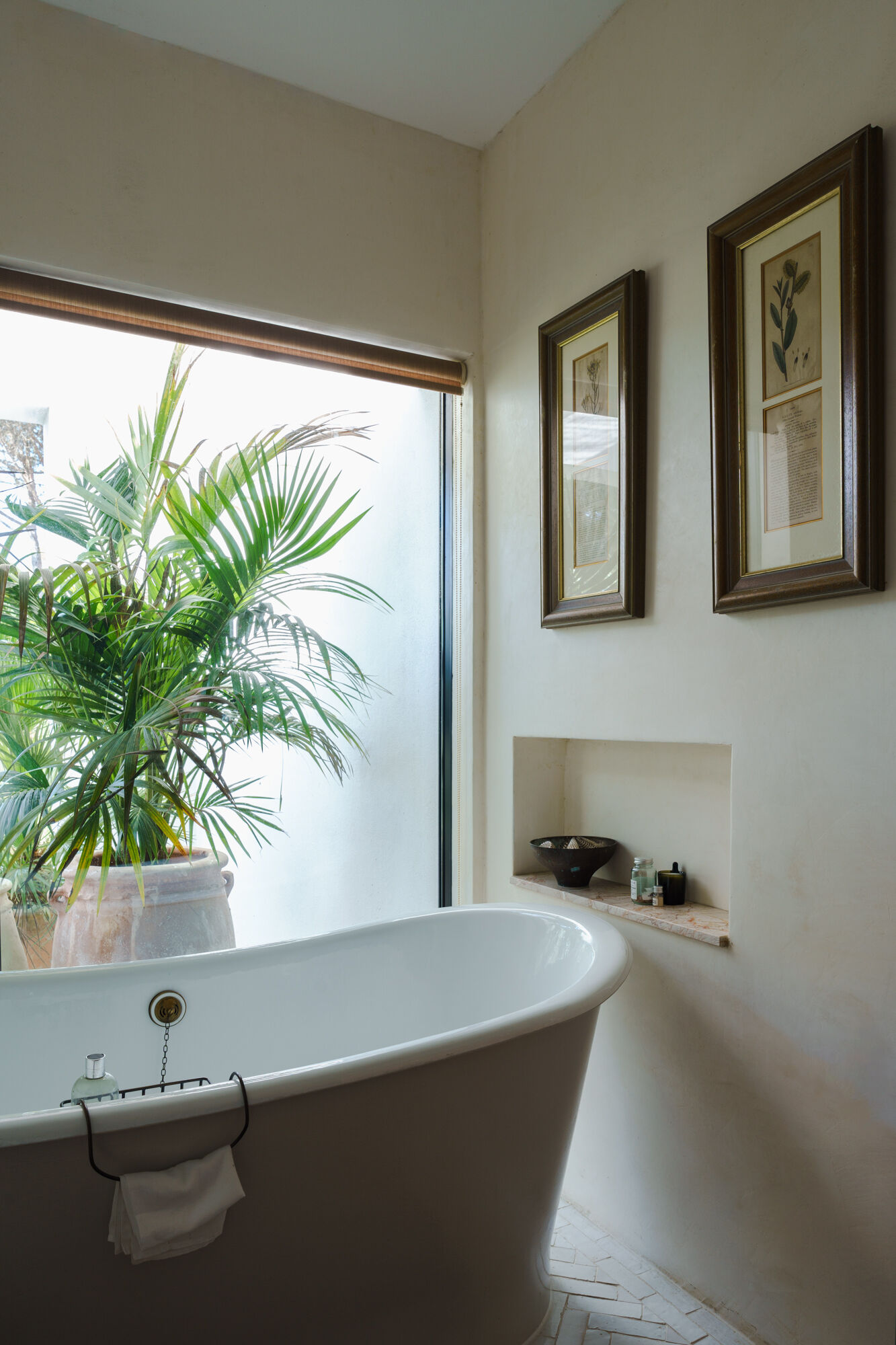 Minimalist bathrooms filled with filtered sunlight and natural textures continue the calm architectural language of this contemporary Portuguese villa.