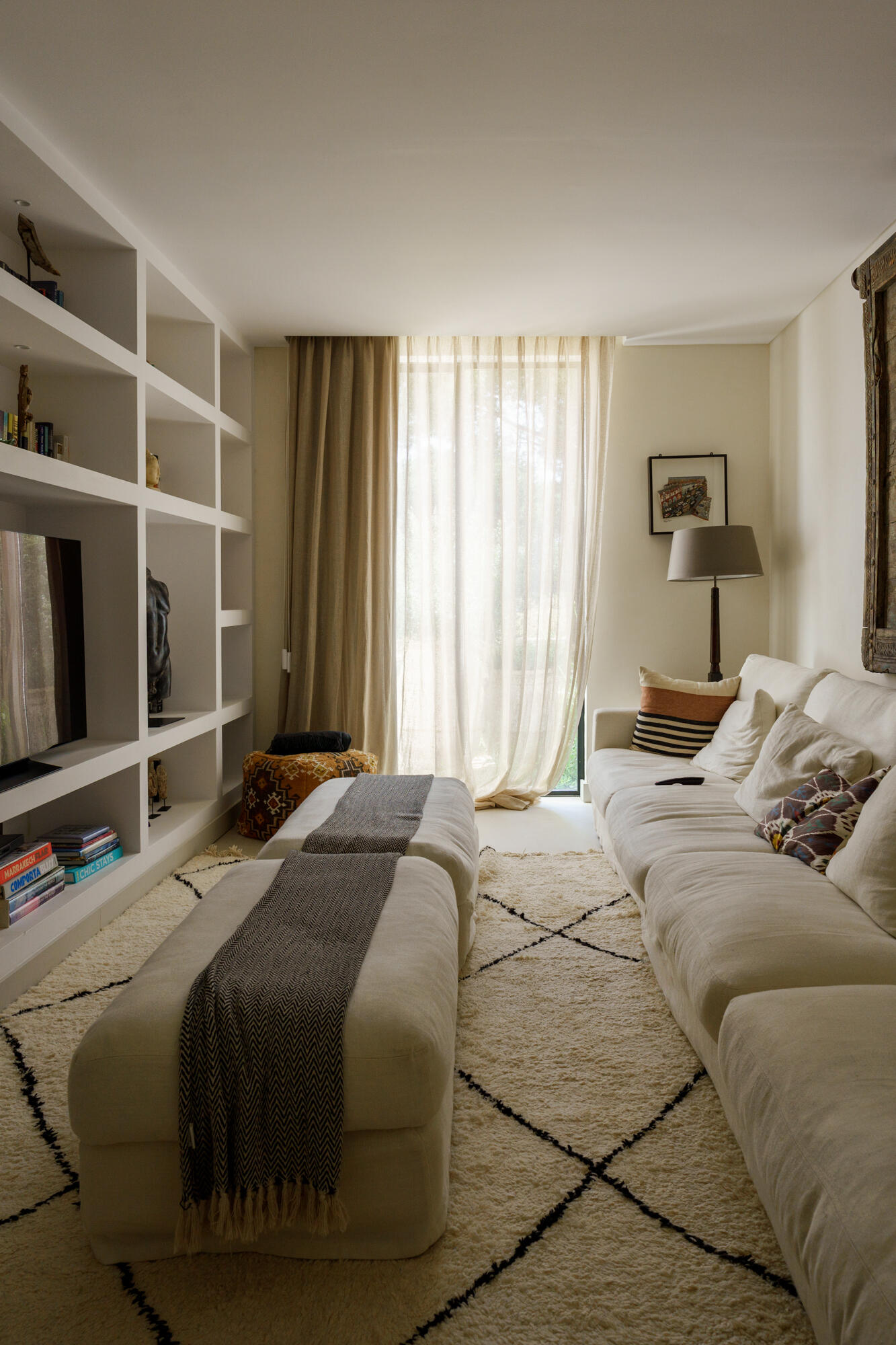 A quieter media room inside Casa na Comporta offers a more intimate contrast to the villa’s bright open-plan living spaces and expansive glazing.