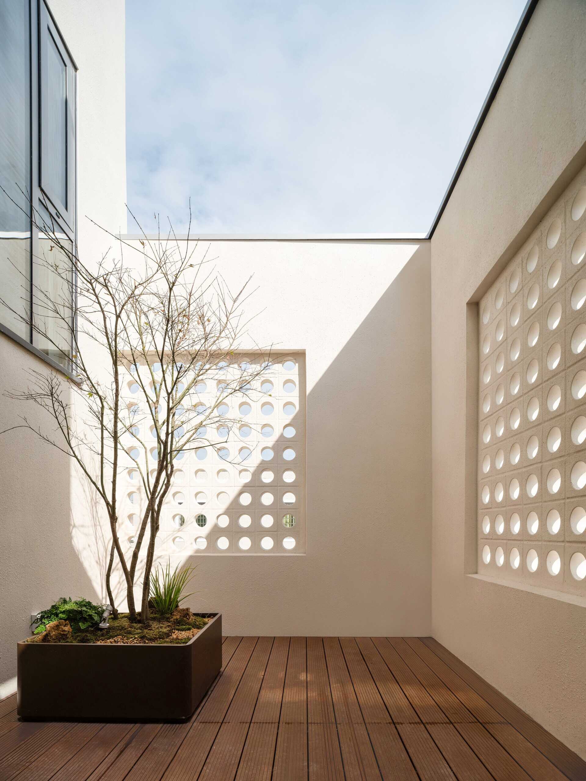 A modern house with a small patio.