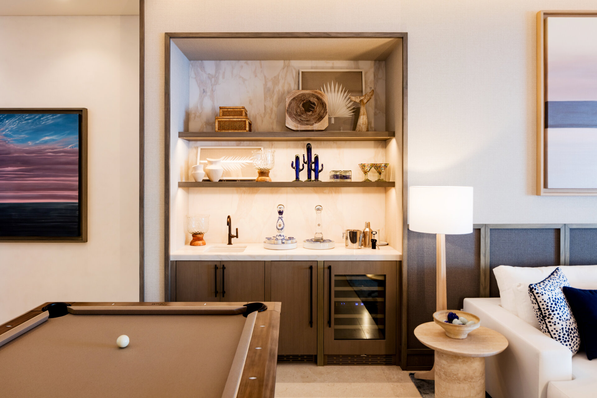 A pool table, bar area, and lounge give this games room an energy that feels active and social instead of overly formal.