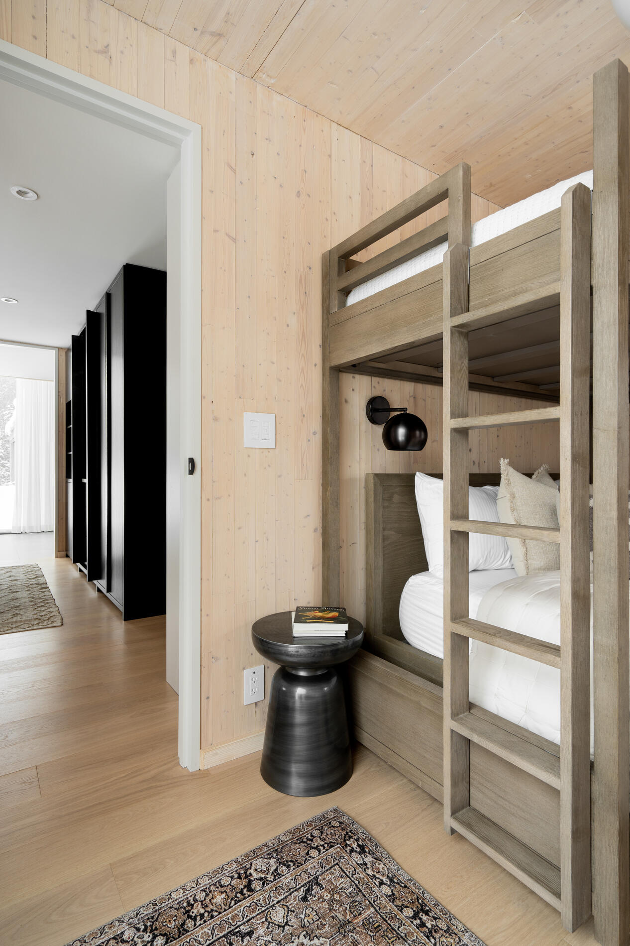 A modern bedroom with bunk beds makes the most of the space.