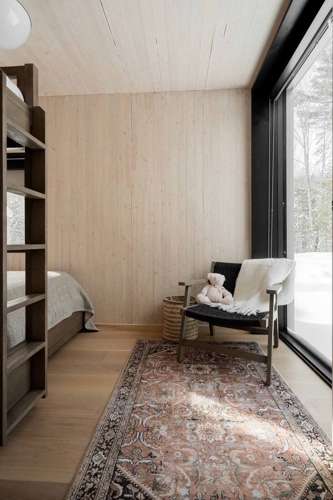 A modern bedroom with bunk beds makes the most of the space.