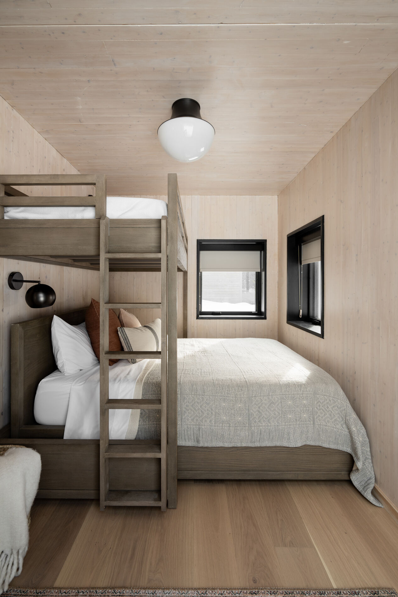 A modern bedroom with bunk beds makes the most of the space.