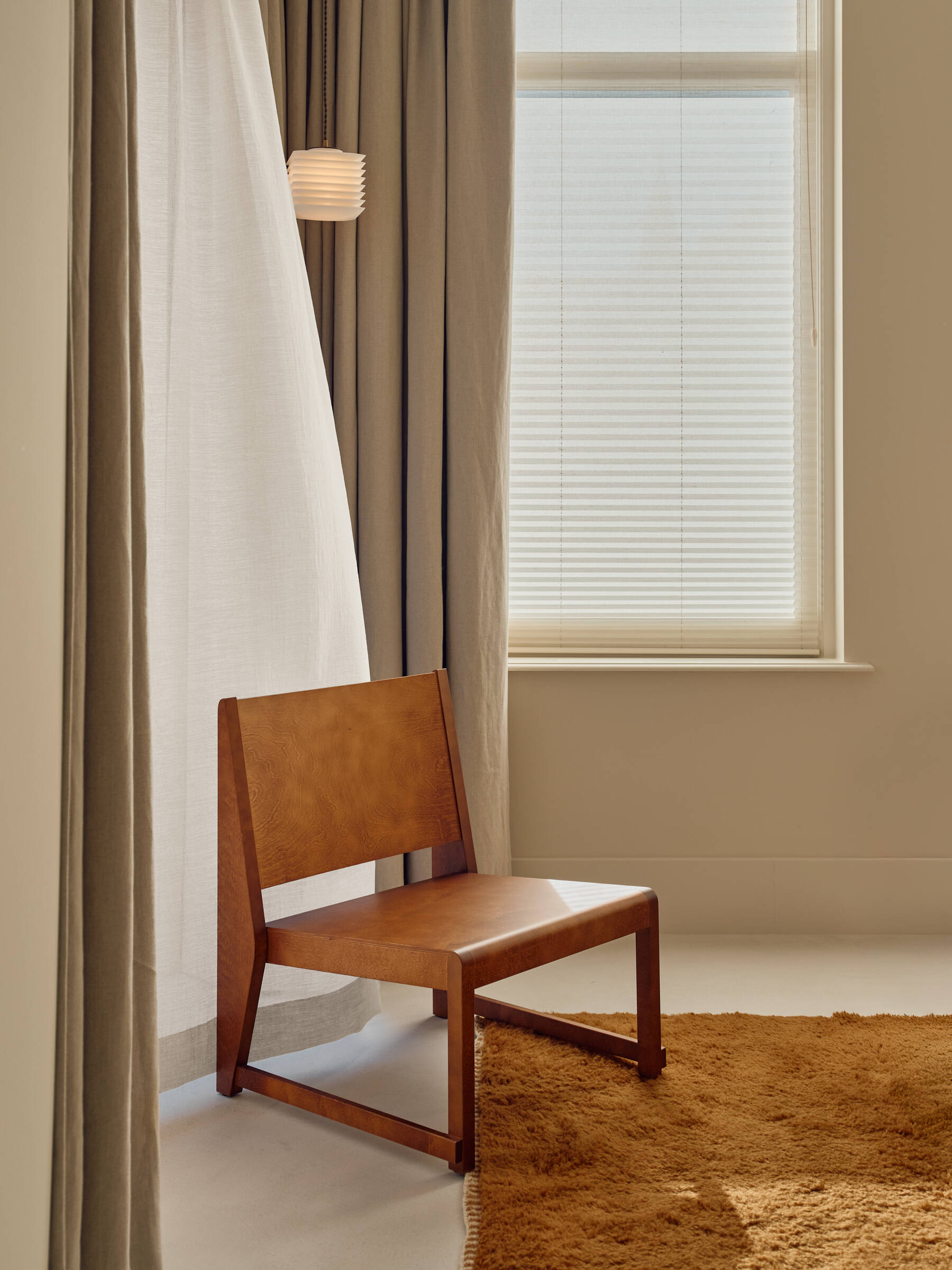 Soft textures, custom bedheads, hidden wardrobes, and warm wood finishes define this calming modern bedroom.
