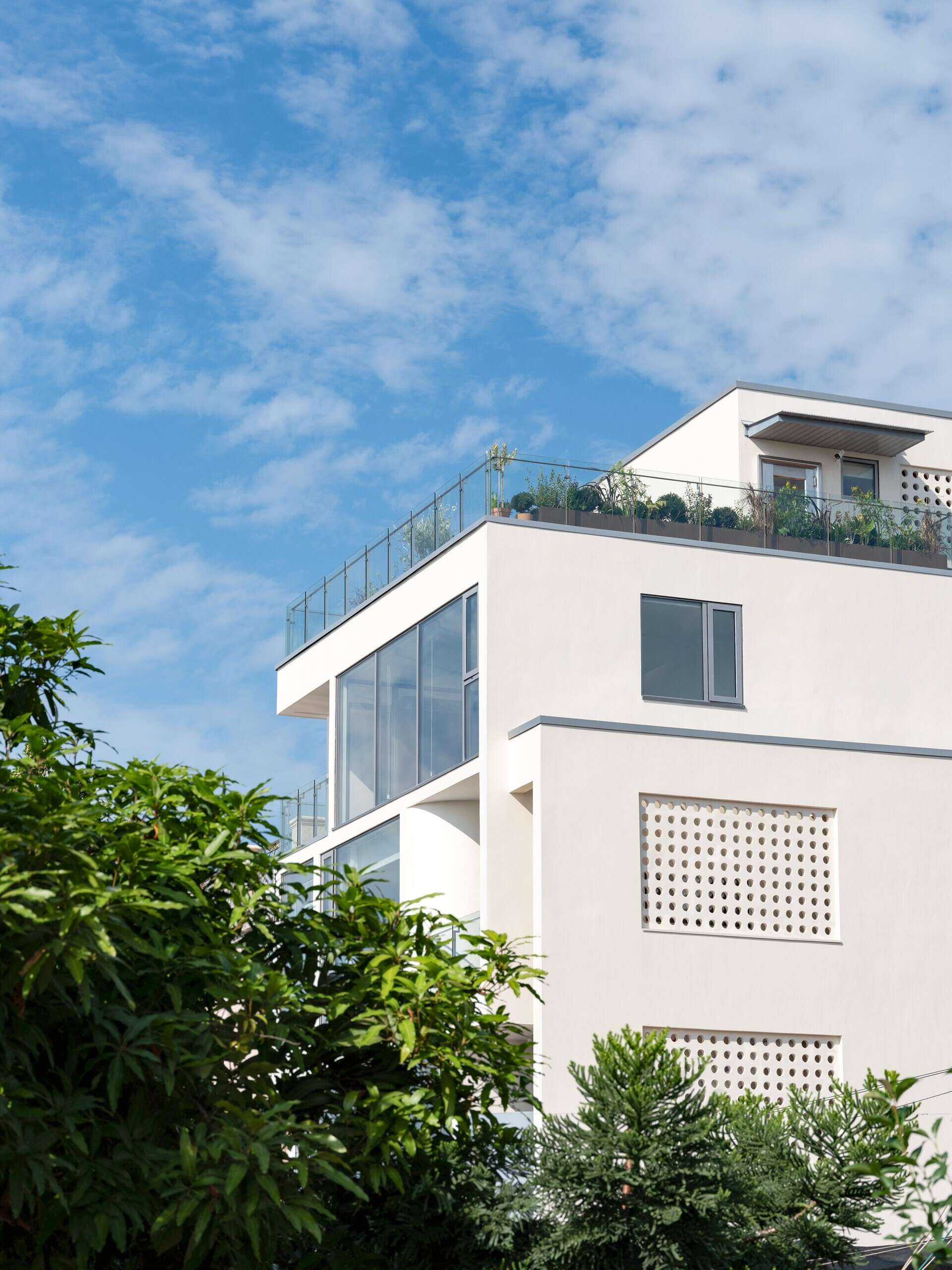 Coastal Villa Residence in Raoping, China by VALUE WORKS ARCHITECTS rethinks rural family living with split-level interiors, sea views and modern multi-generational design on a compact coastal site.