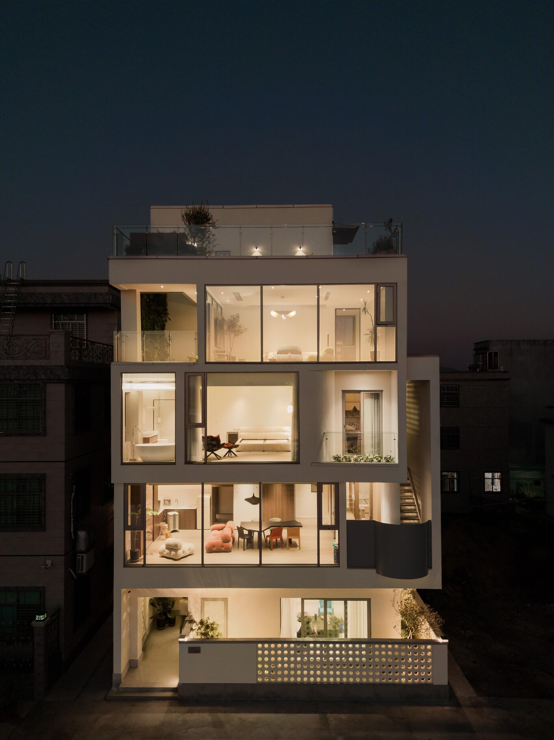 Coastal Villa Residence in Raoping, China by VALUE WORKS ARCHITECTS rethinks rural family living with split-level interiors, sea views and modern multi-generational design on a compact coastal site.