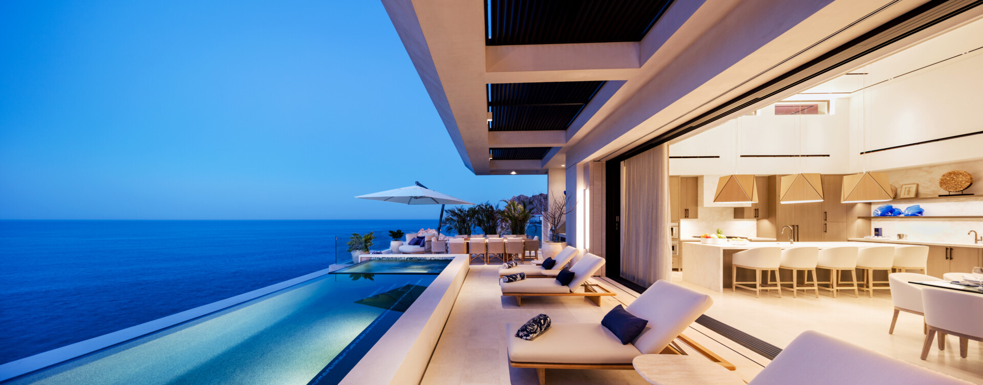 An infinity pool, outdoor dining, and expansive oceanfront lounges define this incredible Los Cabos patio design.