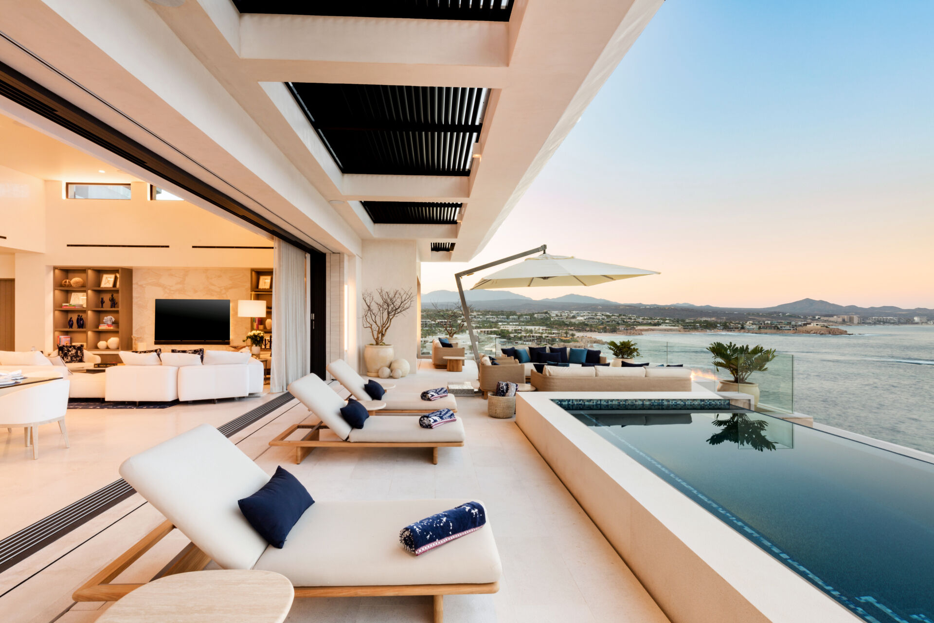 An infinity pool, outdoor dining, and expansive oceanfront lounges define this incredible Los Cabos patio design.