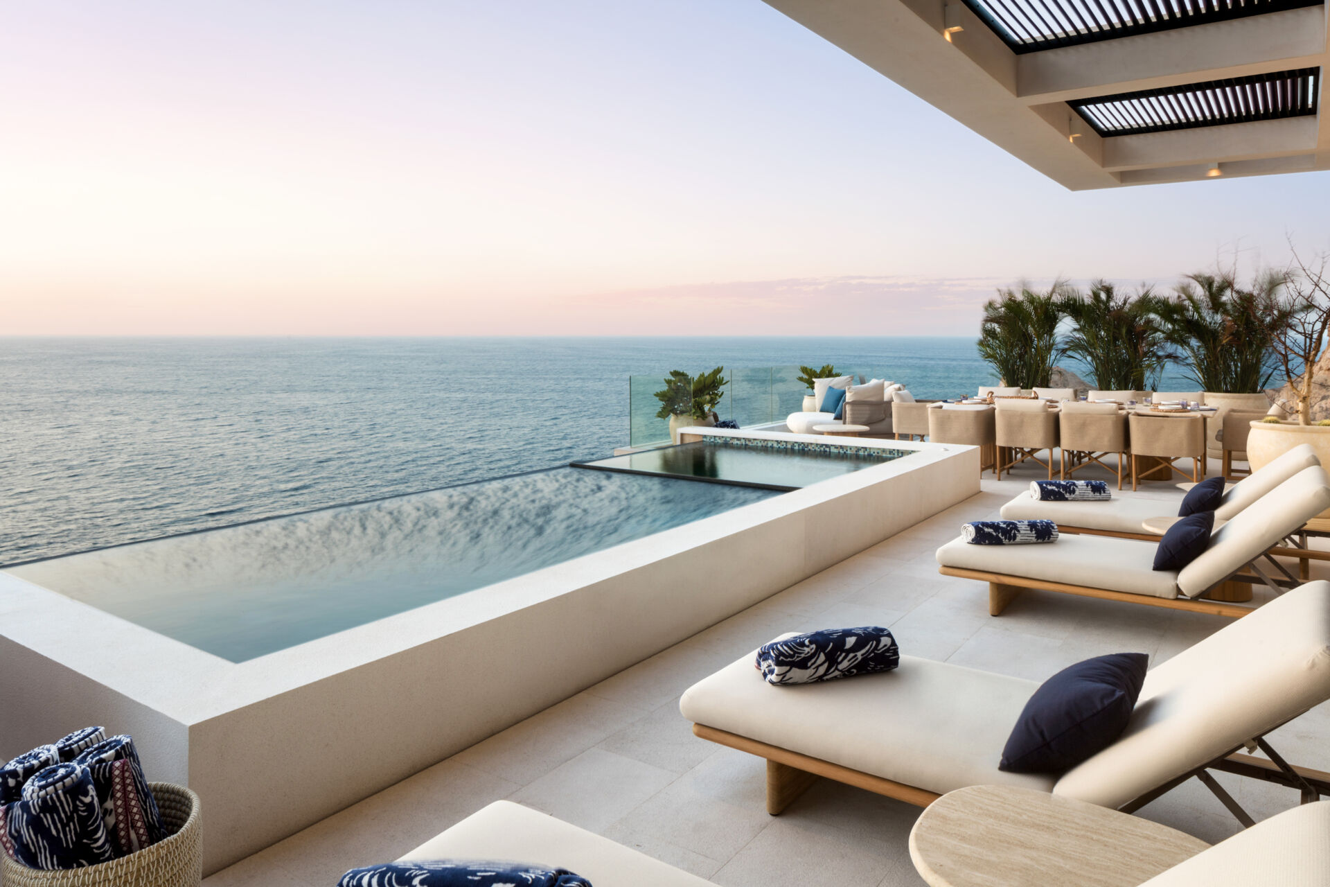 An infinity pool, outdoor dining, and expansive oceanfront lounges define this incredible Los Cabos patio design.