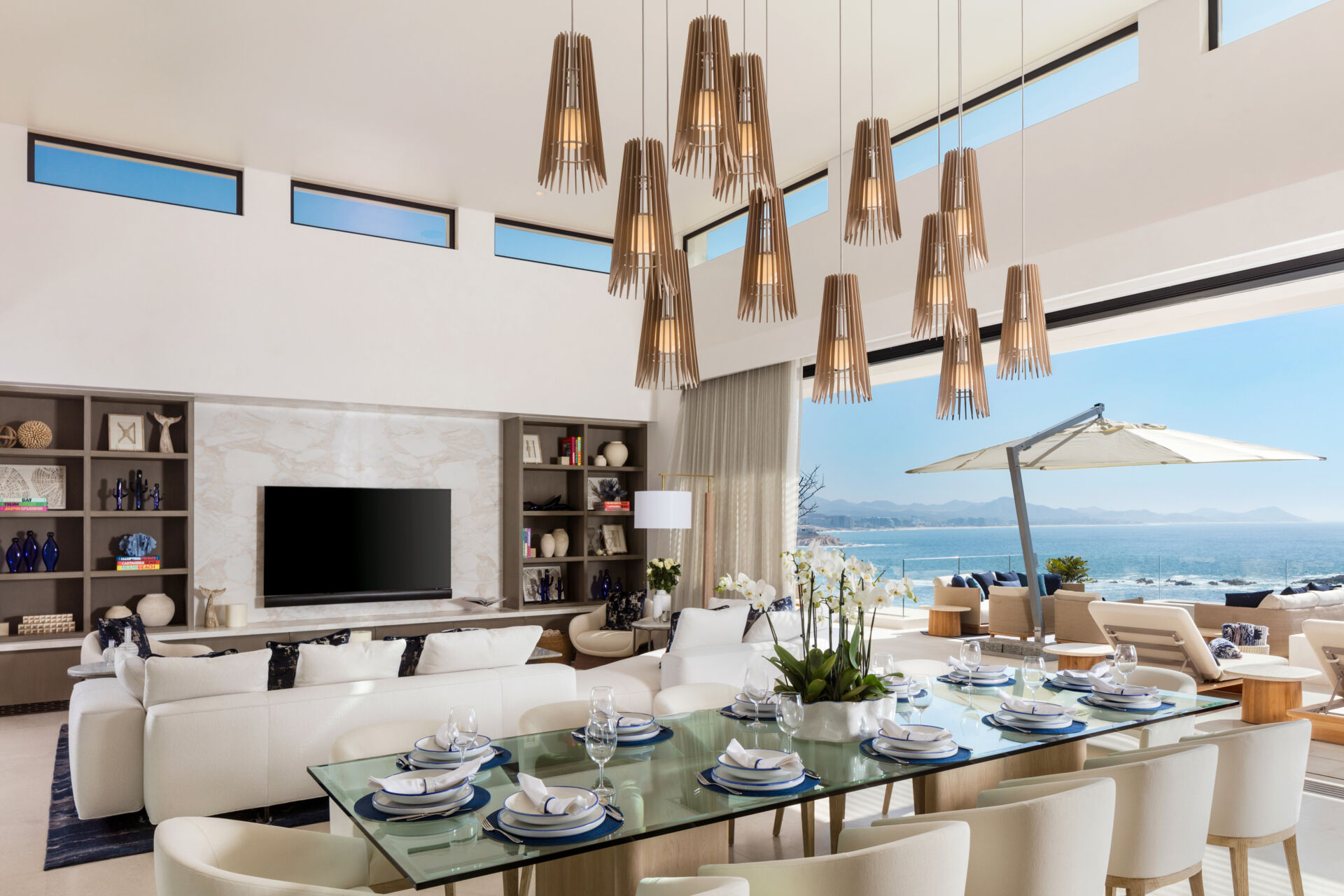 A sculptural cluster of Cerno Lex pendants transforms this Cabo dining room into a dramatic yet inviting gathering space.