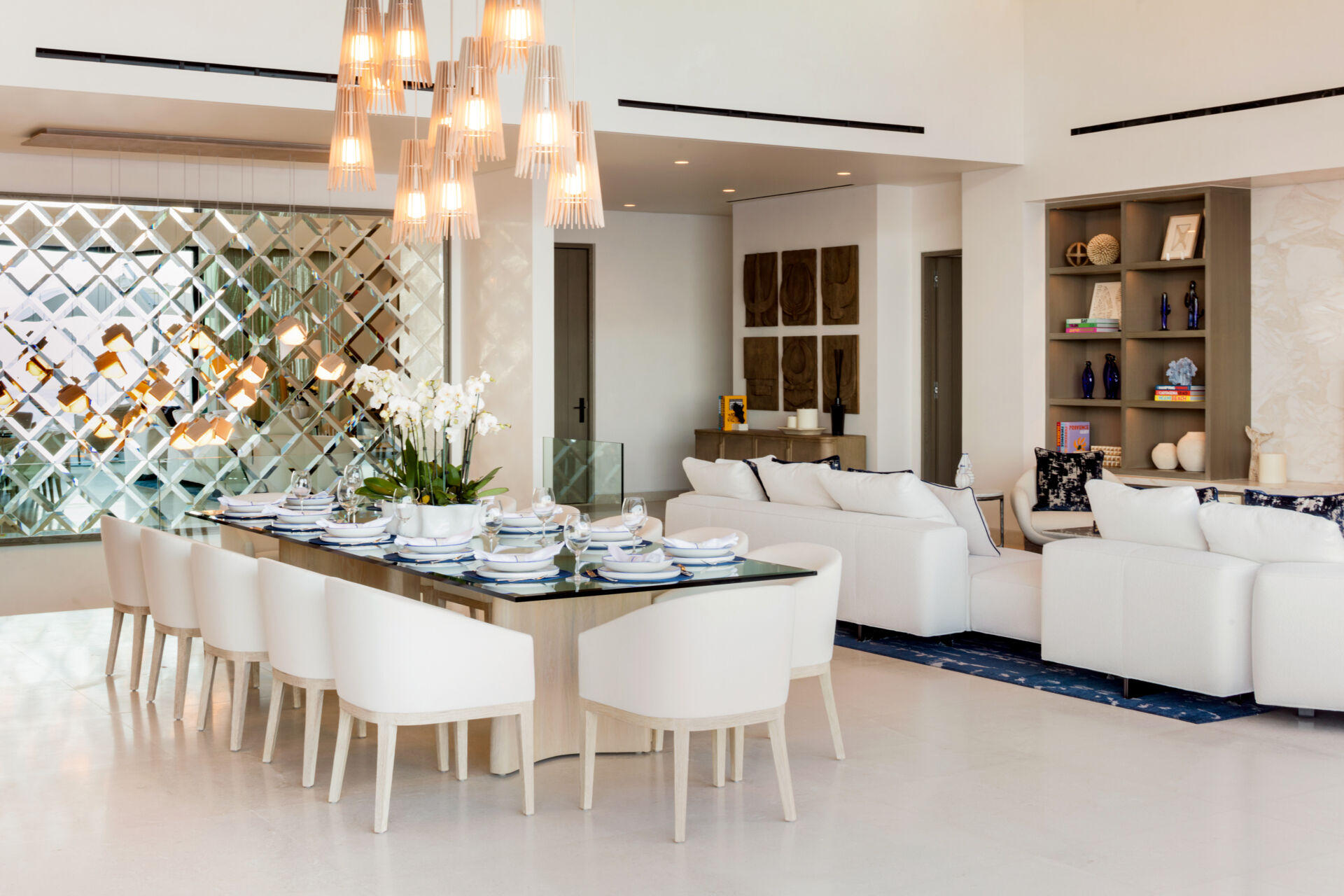 A sculptural cluster of Cerno Lex pendants transforms this Cabo dining room into a dramatic yet inviting gathering space.