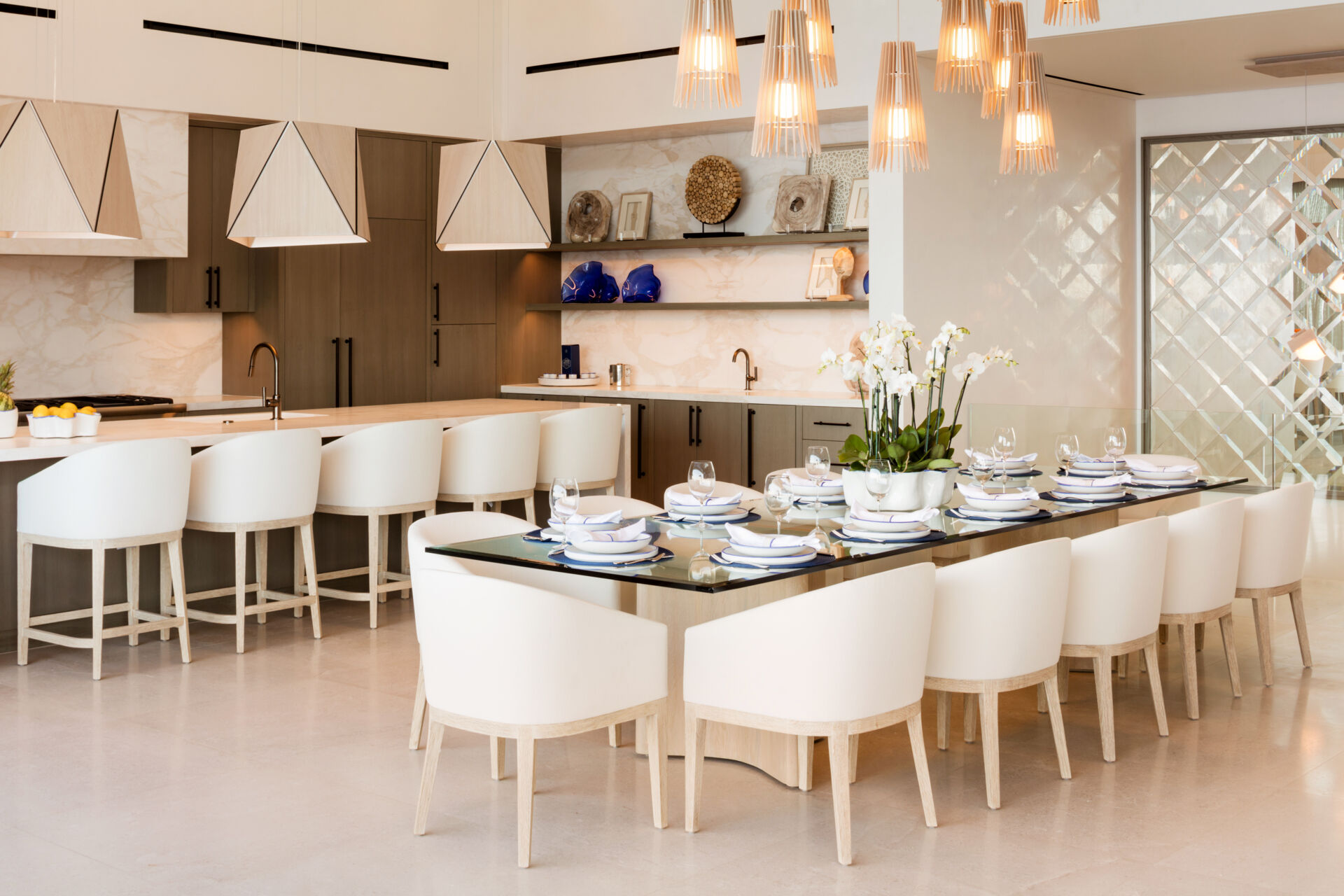 A sculptural cluster of Cerno Lex pendants transforms this Cabo dining room into a dramatic yet inviting gathering space.