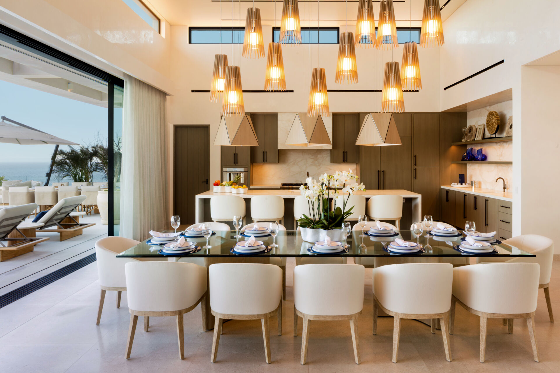 A sculptural cluster of Cerno Lex pendants transforms this Cabo dining room into a dramatic yet inviting gathering space.
