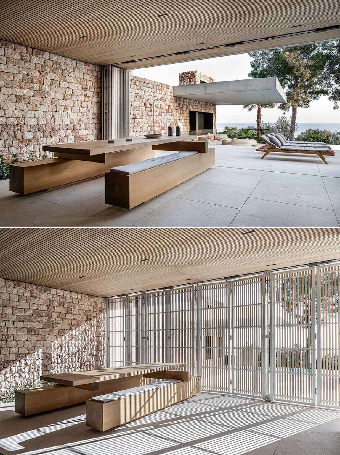A minimalist kitchen with wood cabinetry and sliding glass walls opens directly onto a covered outdoor dining space in Mallorca.