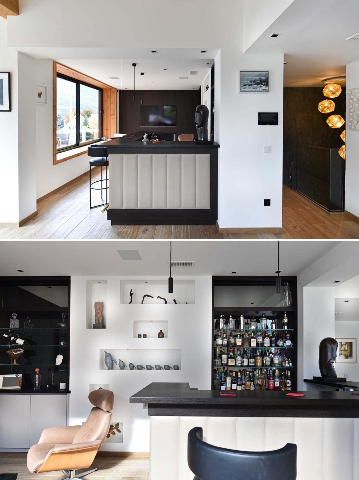 Adjacent to the dining area is a moody bar space with large windows and a dark accent wall. The darker tones help the television visually disappear into the background, allowing the room to feel more refined and less technology-focused.