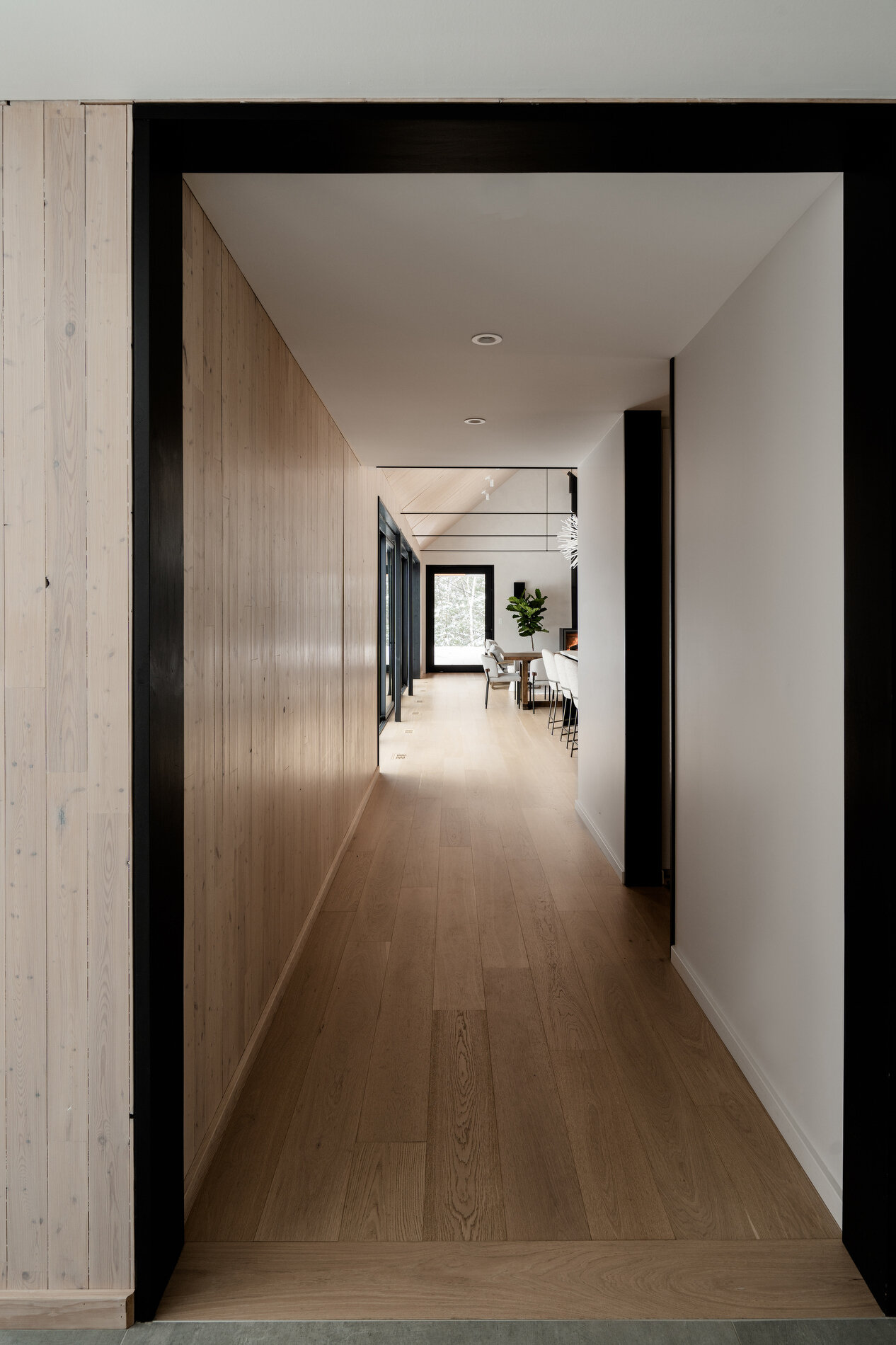 Simple connecting hallways that lead into private zones, maintaining flow while preserving separation within the home.