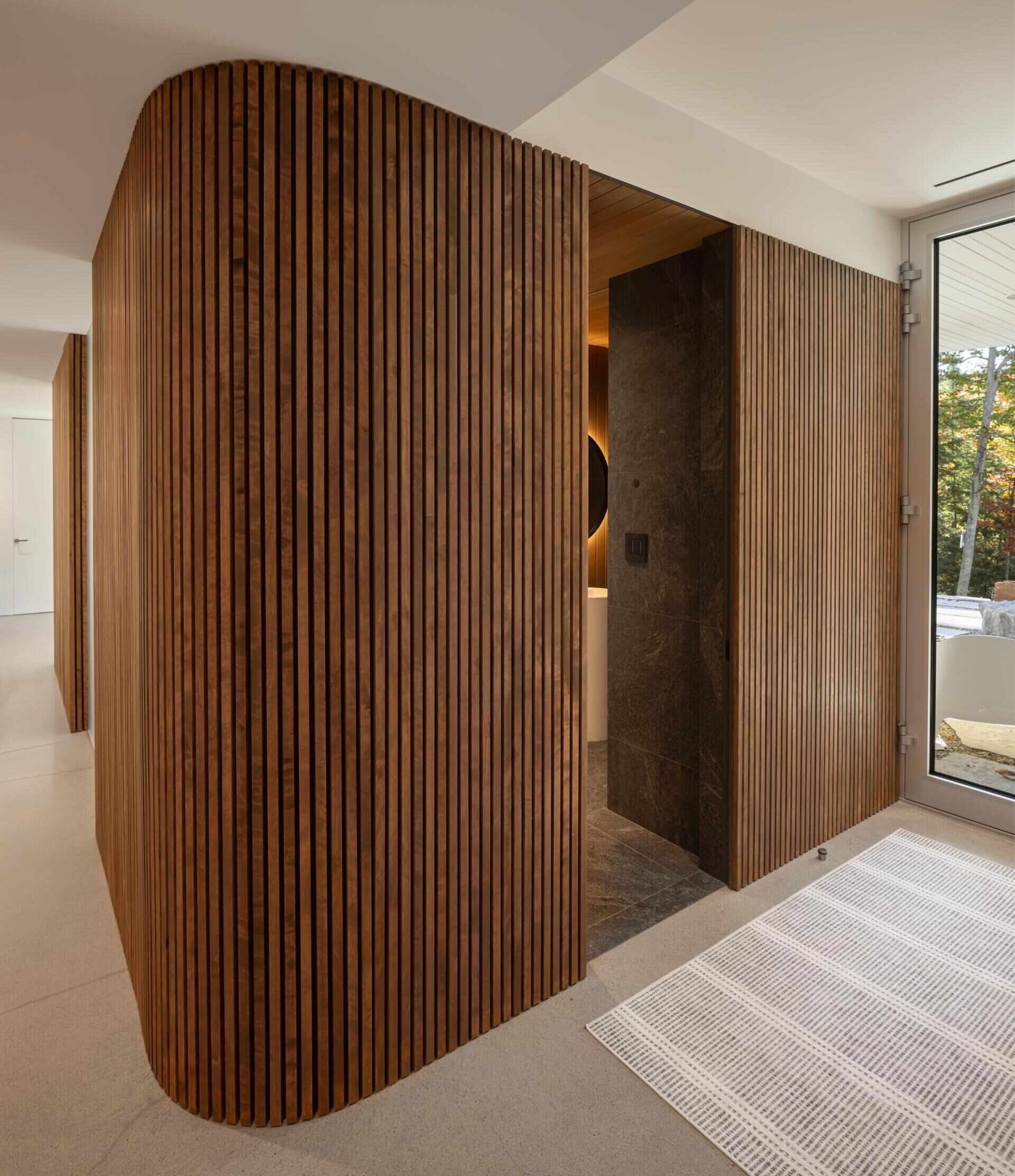 Sauna, cold plunge, hot tub, gym, and lake access turn this wellness zone into one of the most luxurious spaces in the entire home.