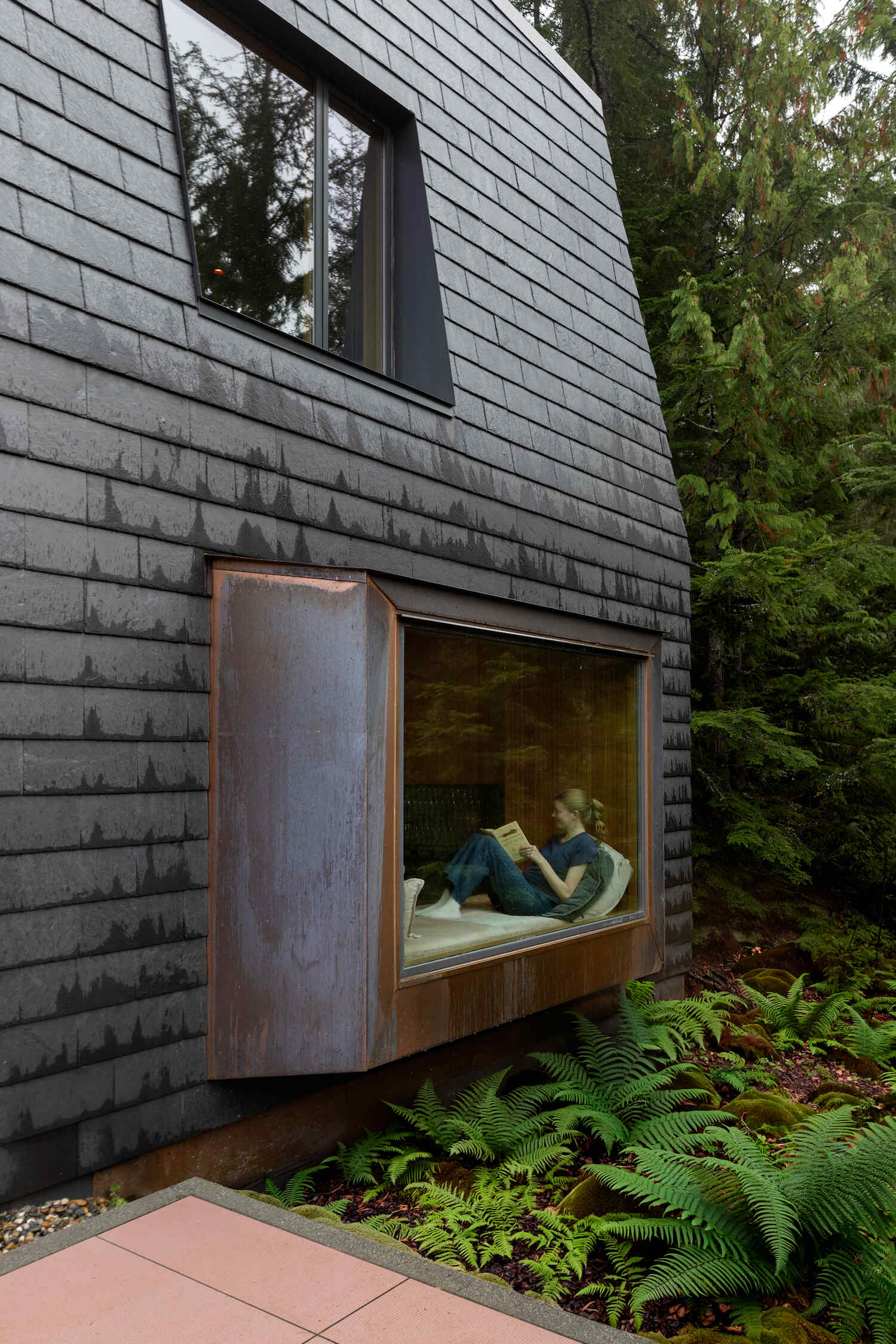 Cascading green roofs, copper-clad details, and forest-inspired materials make this Whistler mountain home feel tucked into the landscape.