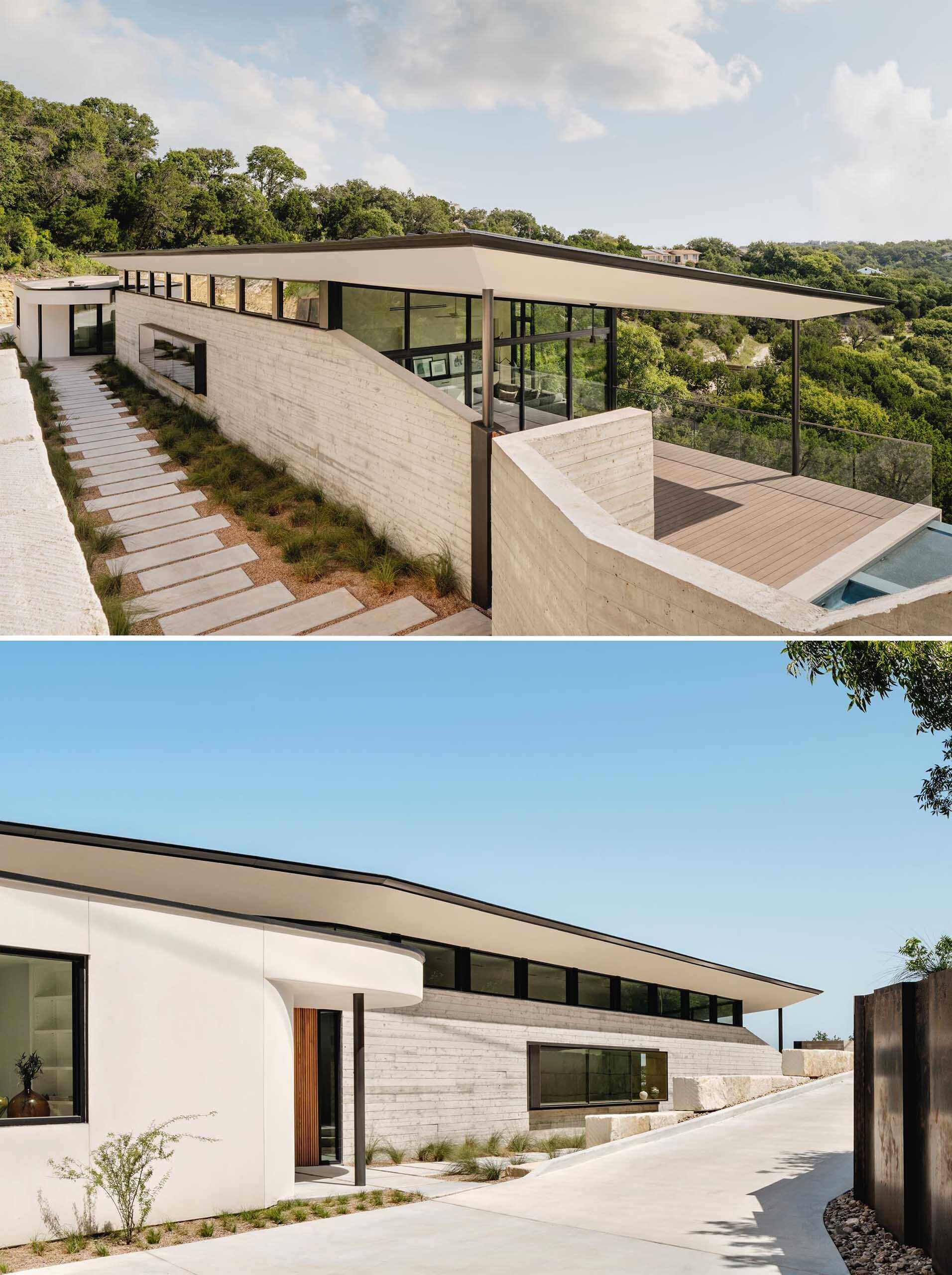 Board-formed concrete walls, grasses, and warm wood details shape the entrance to this modern Austin home.