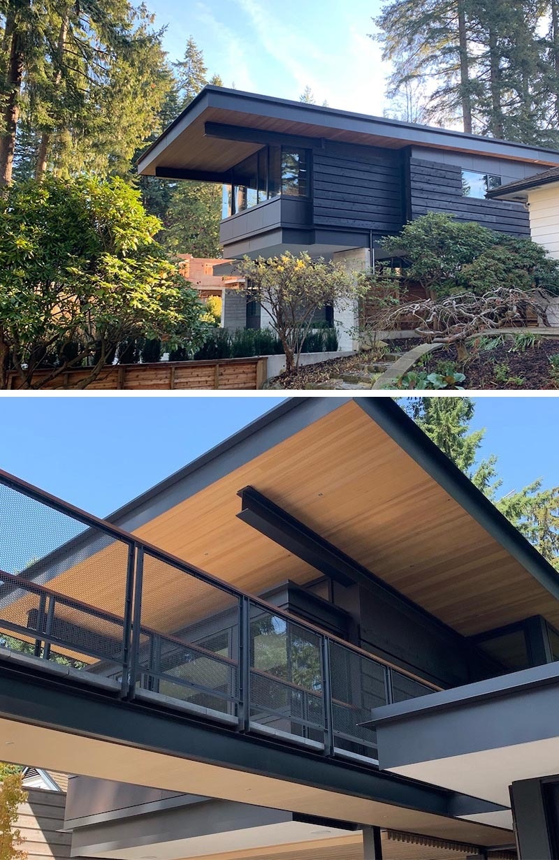 Large overhanging roofs, black steel beams, and wood-lined soffits give this modern Canadian home a bold West Coast look.