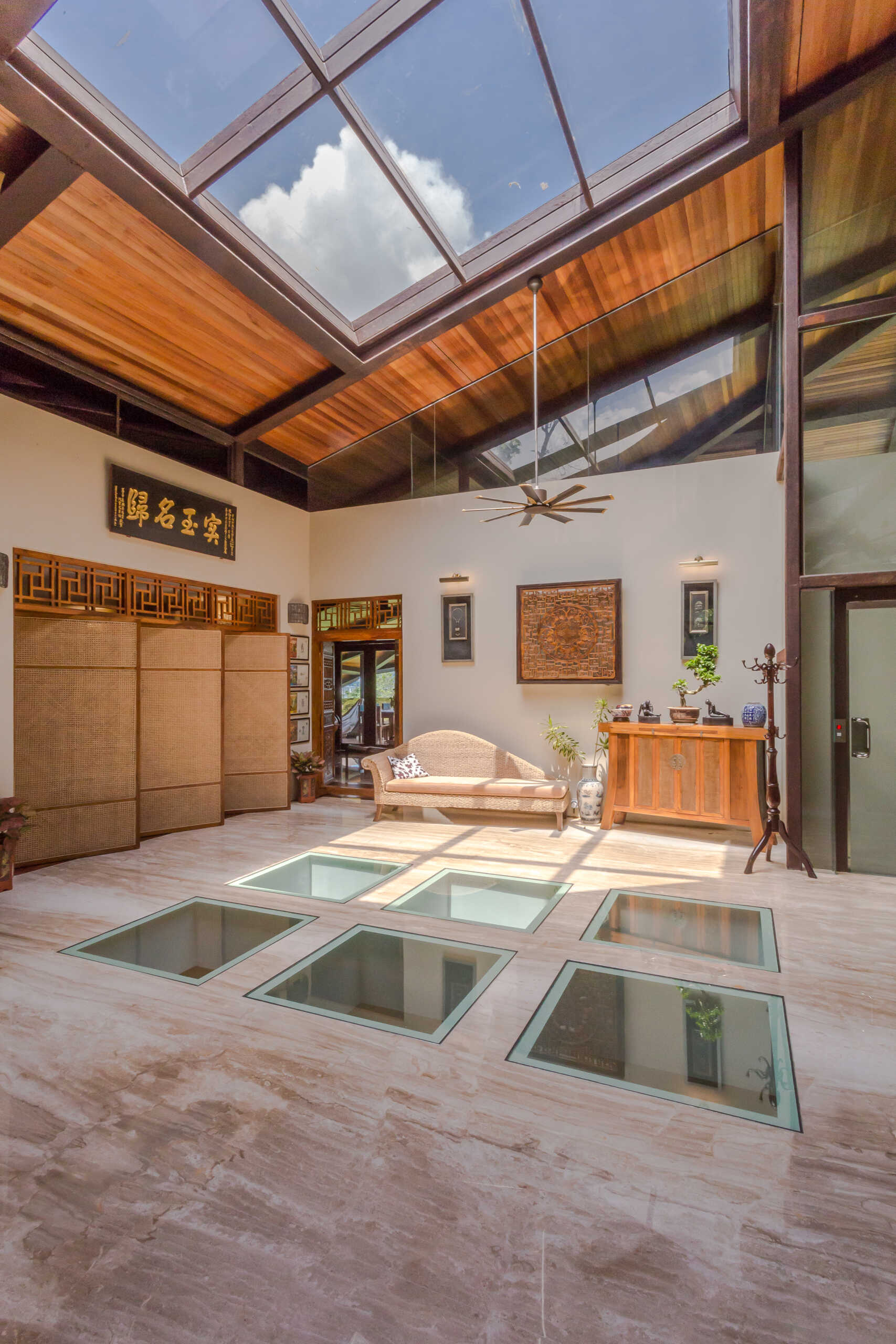 Stepping inside, skylights provide natural light from above, while windows in the floor, give a glimpse of the level below.