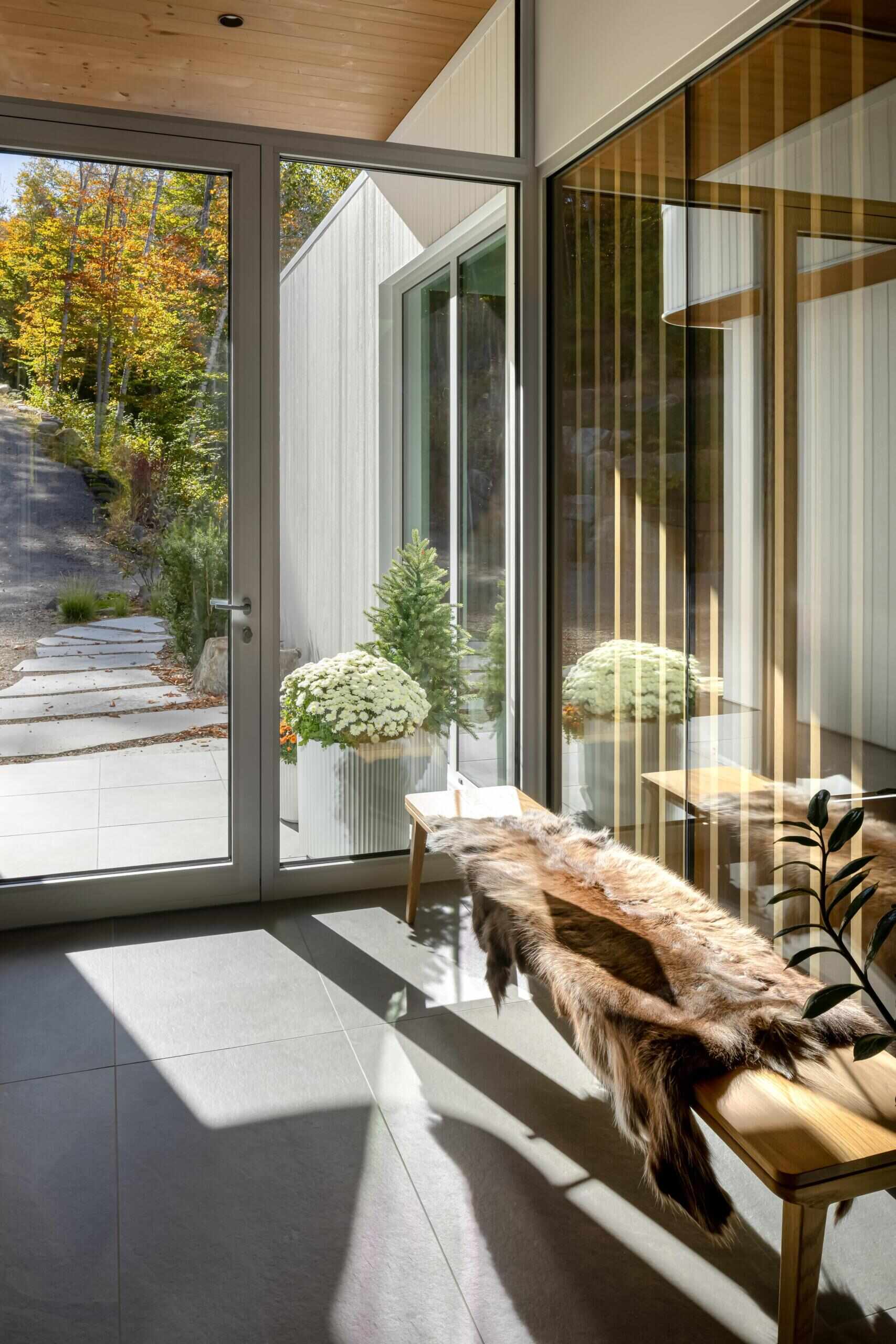 The entry sequence introduces the home’s balance of scale and comfort. Visitors step into a spacious arrival area connected directly to the double garage and an oversized mudroom designed for an active outdoor lifestyle.