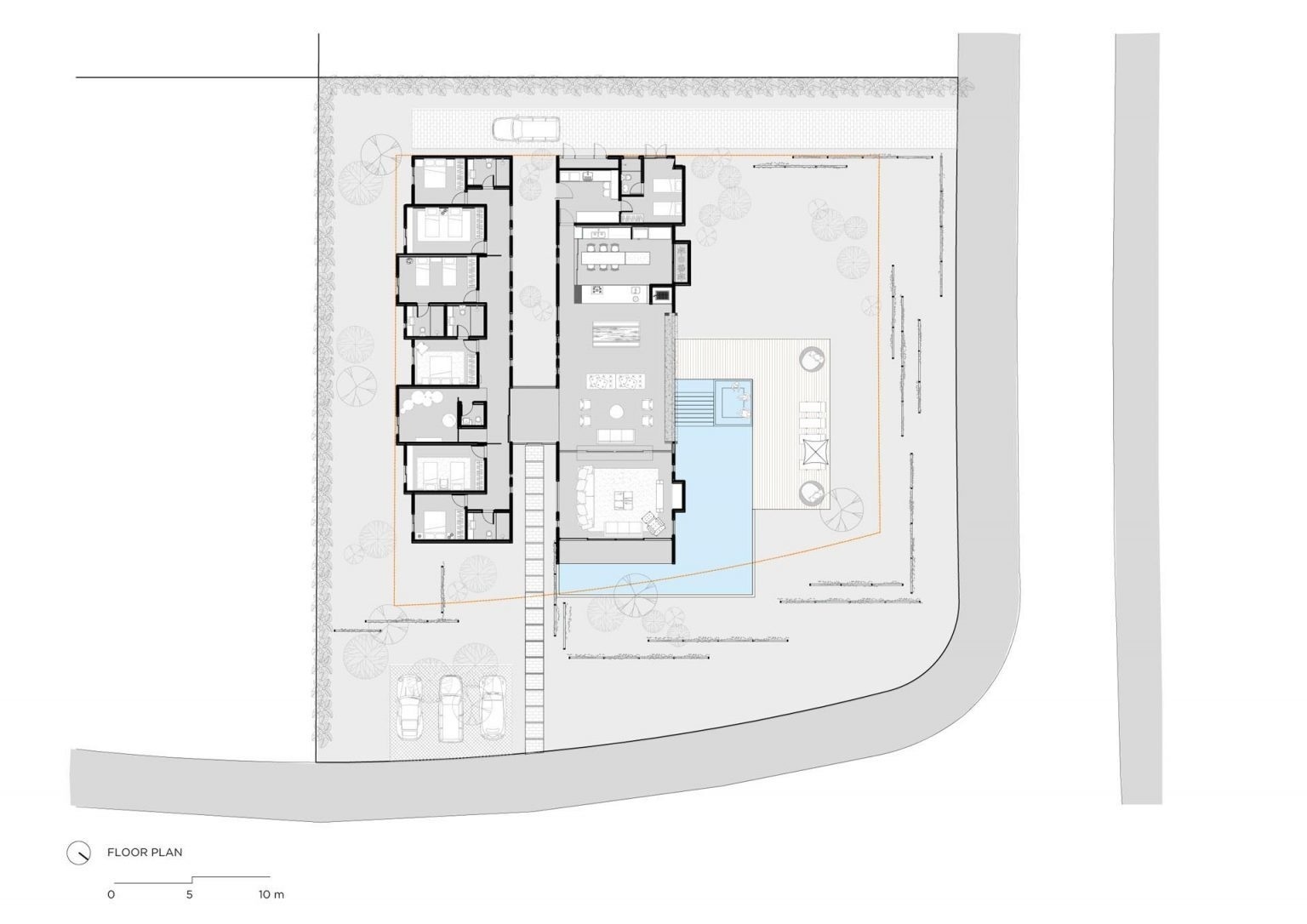 A split layout with two volumes and a central garden creates a clear balance between social spaces and private rooms.