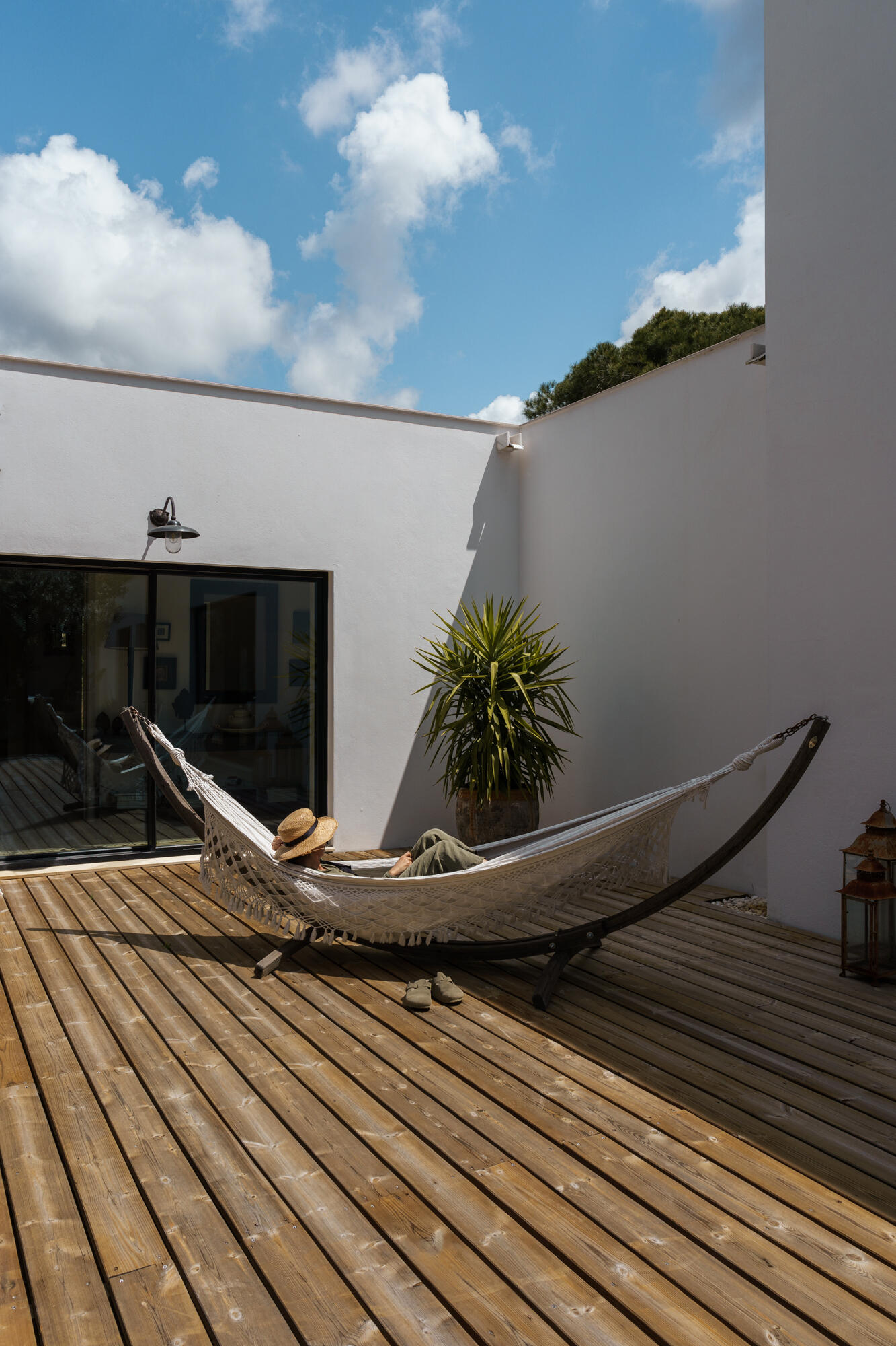 From sandy terraces to shaded seating areas beneath cork oaks, the outdoor spaces at Casa na Comporta are designed for relaxed summer living in Portugal.