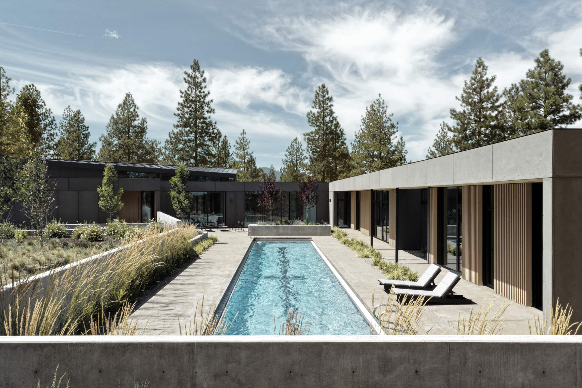 A sheltered lap pool wrapped by modern architecture creates one of the most relaxing spaces in this stunning Bend, Oregon hideaway.