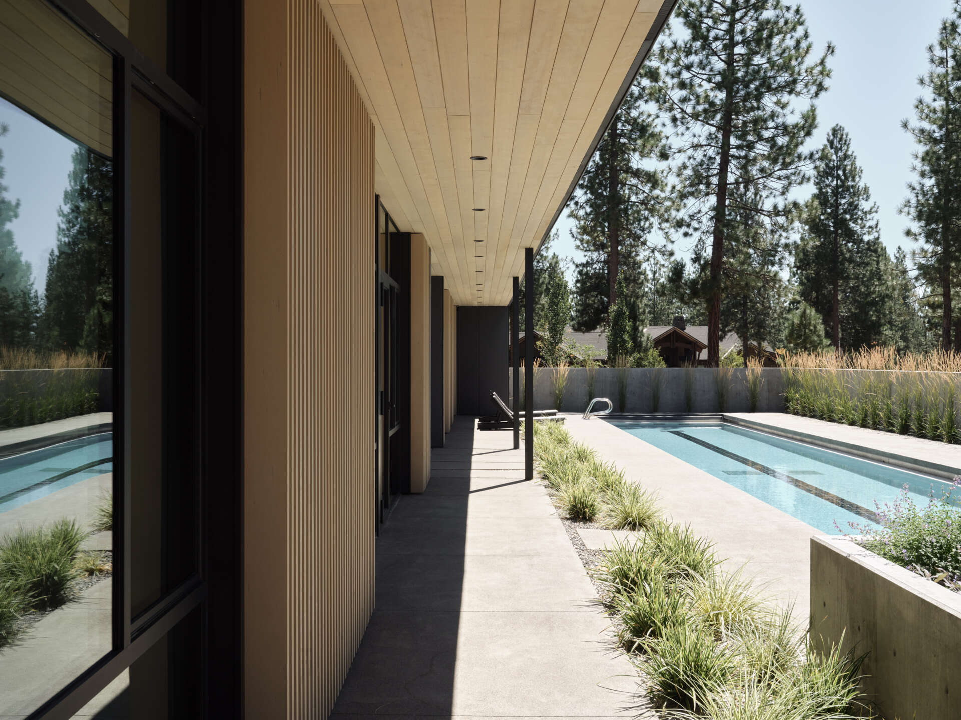 A sheltered lap pool wrapped by modern architecture creates one of the most relaxing spaces in this stunning Bend, Oregon hideaway.