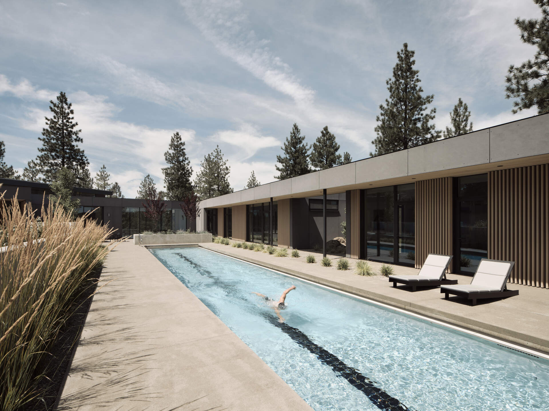 A sheltered lap pool wrapped by modern architecture creates one of the most relaxing spaces in this stunning Bend, Oregon hideaway.
