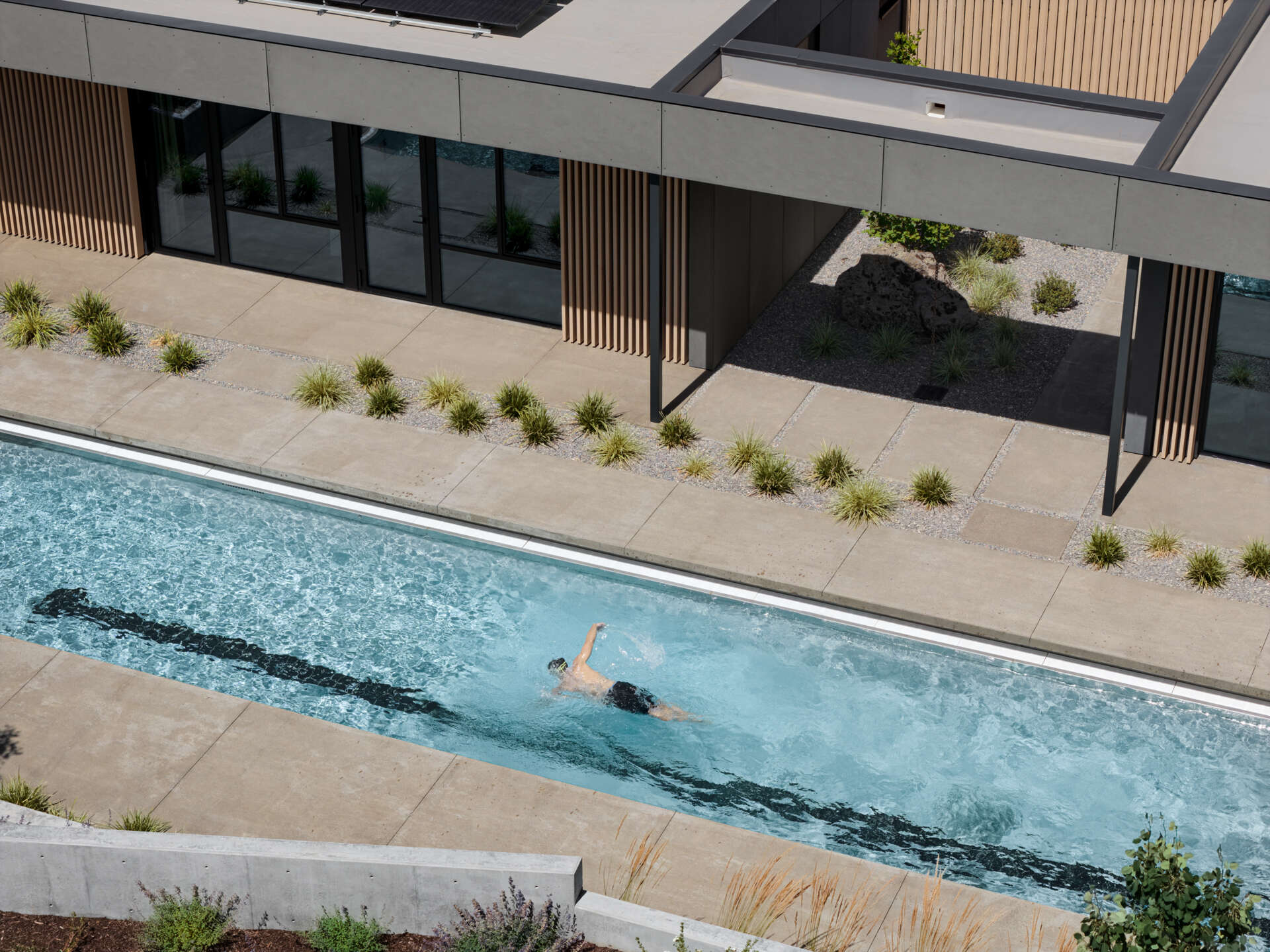 A sheltered lap pool wrapped by modern architecture creates one of the most relaxing spaces in this stunning Bend, Oregon hideaway.