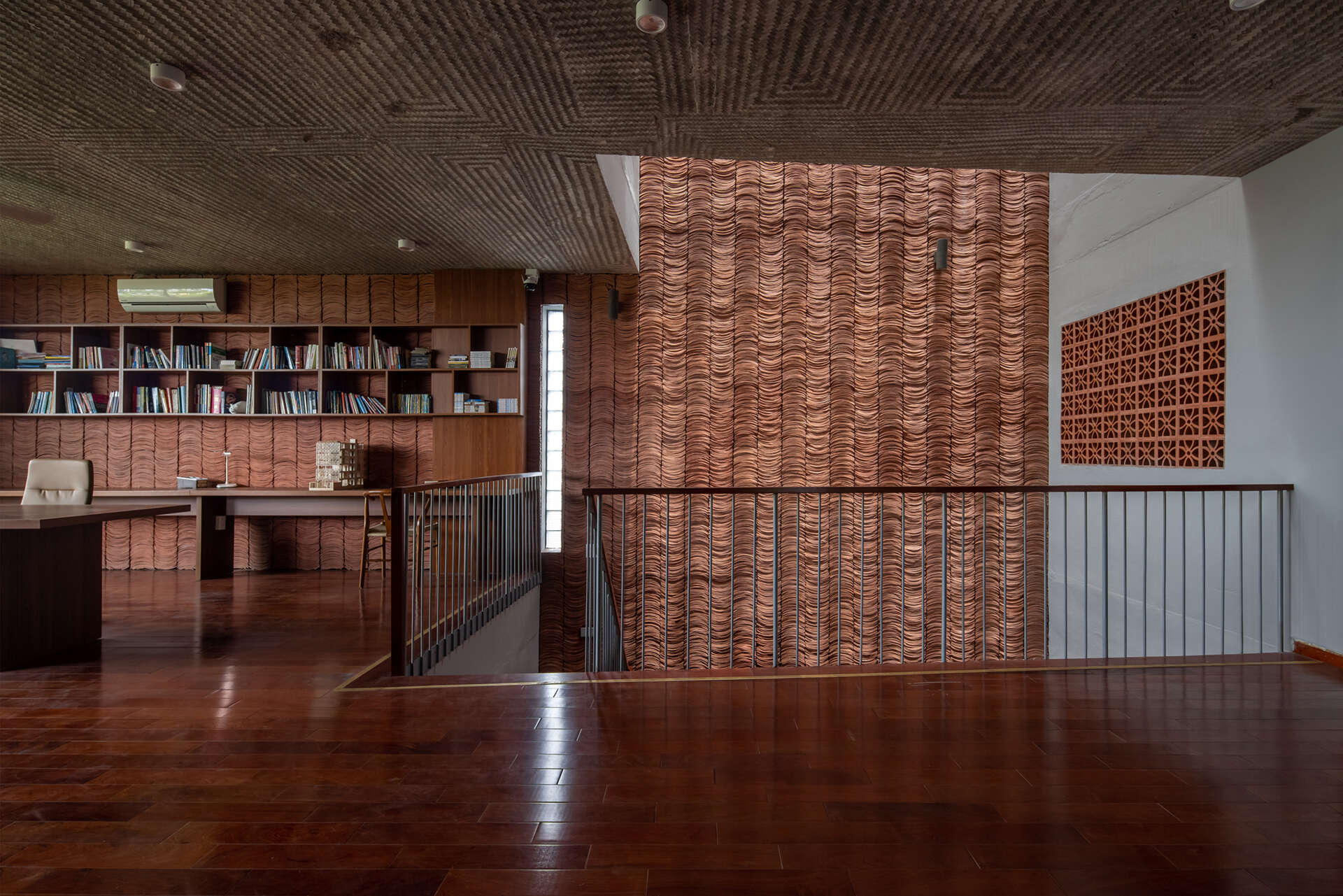 Traditional yin yang tiles and ceramic materials link the house to familiar building techniques.