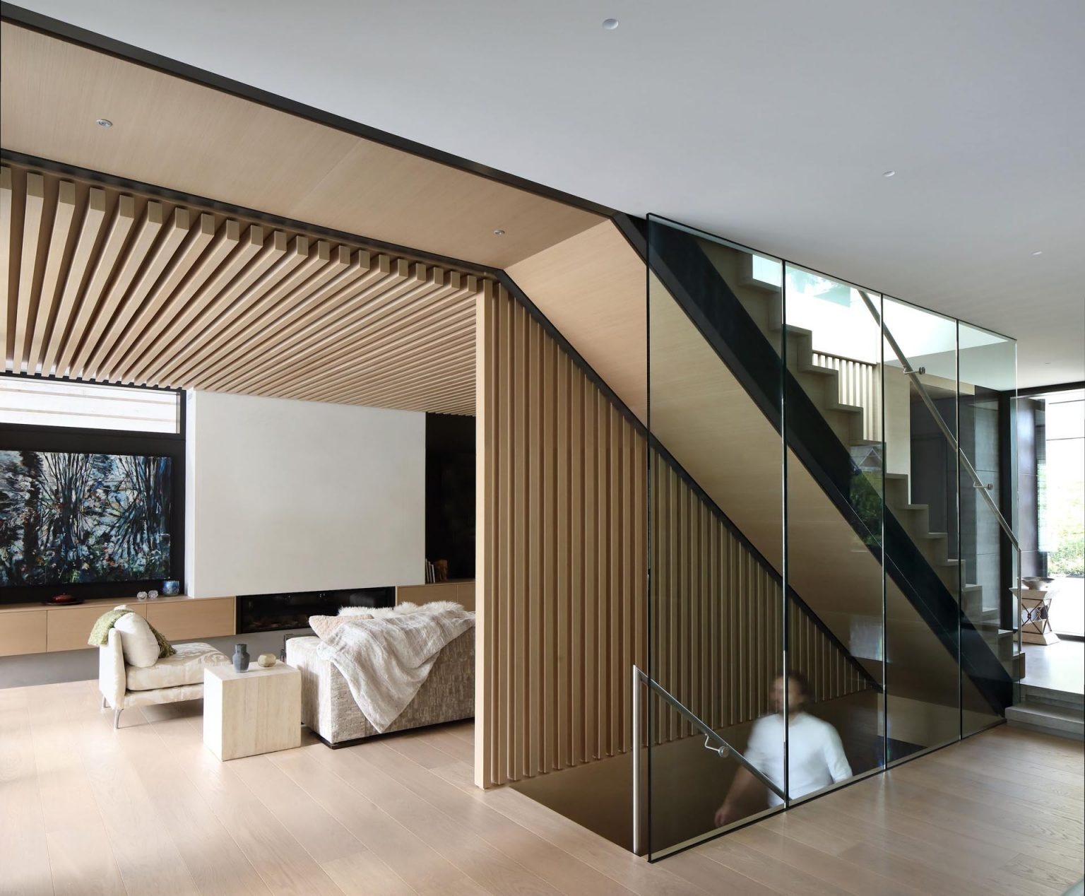 Light wood interiors and open-plan living spaces bring warmth to this contemporary Canadian home.