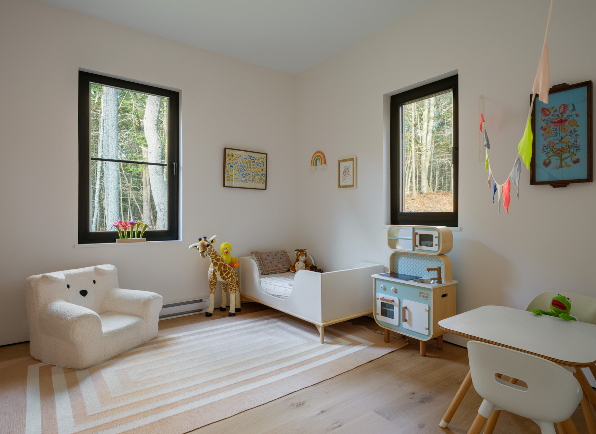 Simple interiors, natural light, and warm wood finishes give these kids’ rooms a clean and modern look.