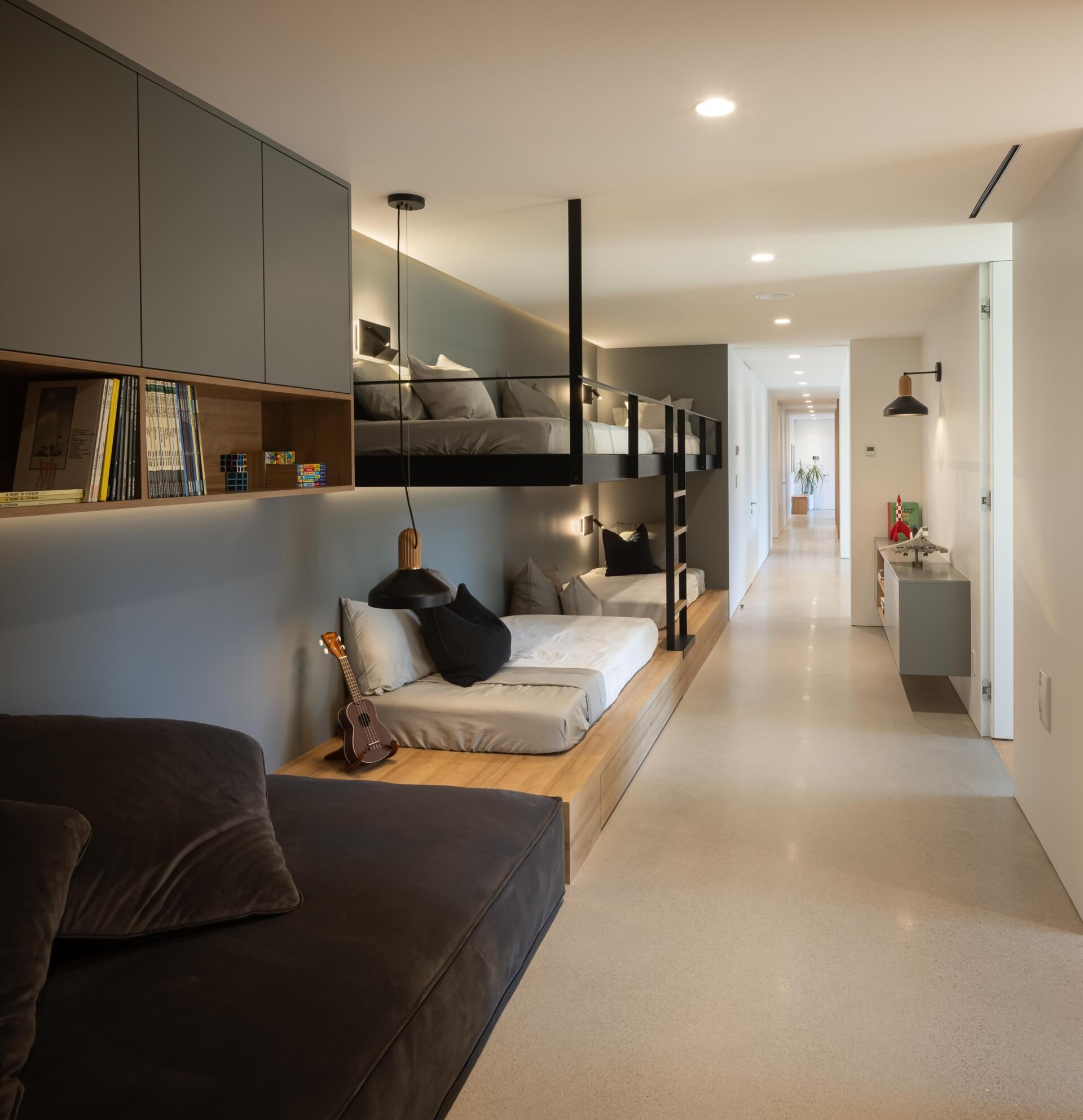 Built-in bunk beds and a spacious playroom bring a fun family-focused atmosphere to this modern lakeside home in Québec.