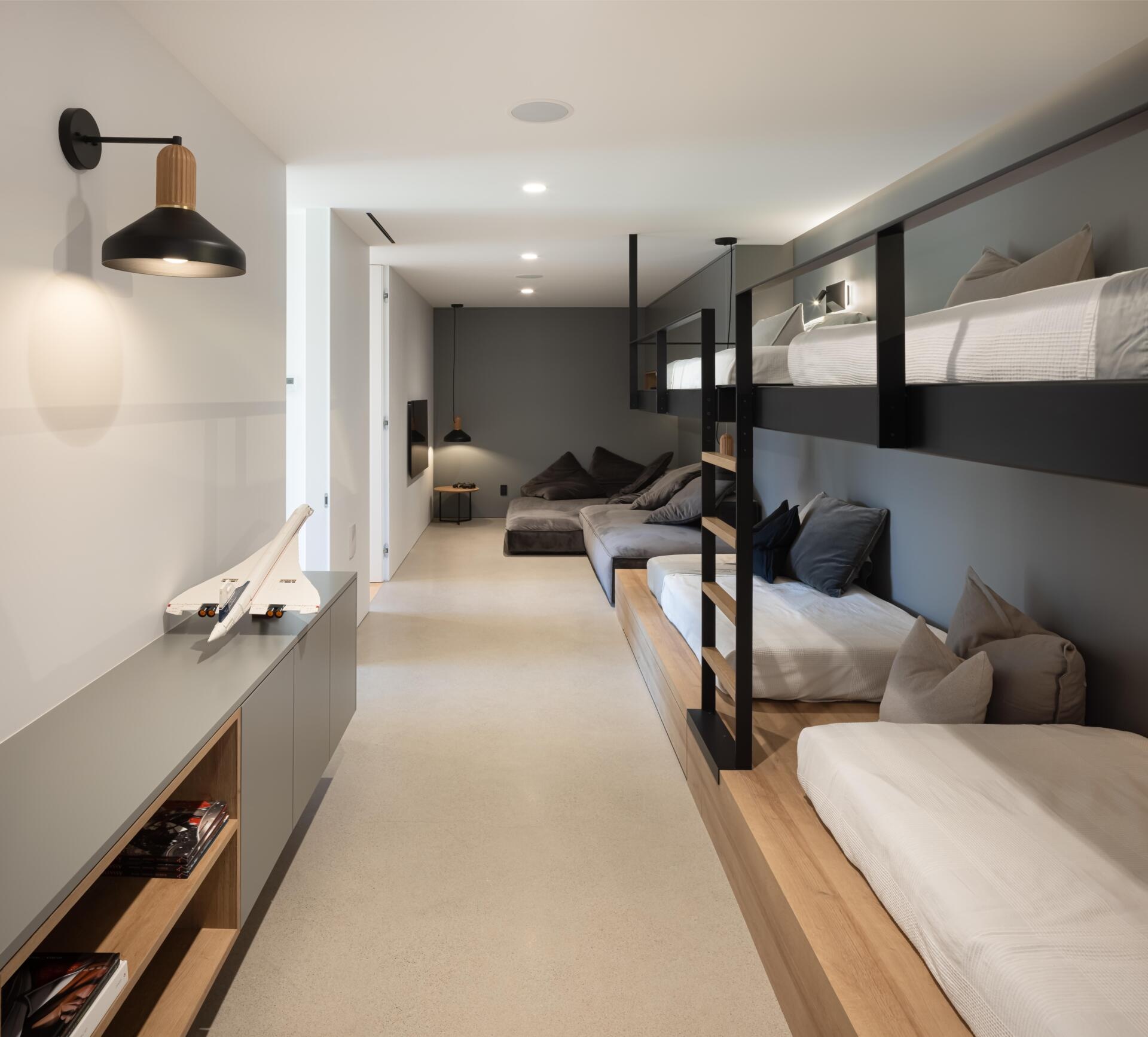 Built-in bunk beds and a spacious playroom bring a fun family-focused atmosphere to this modern lakeside home in Québec.