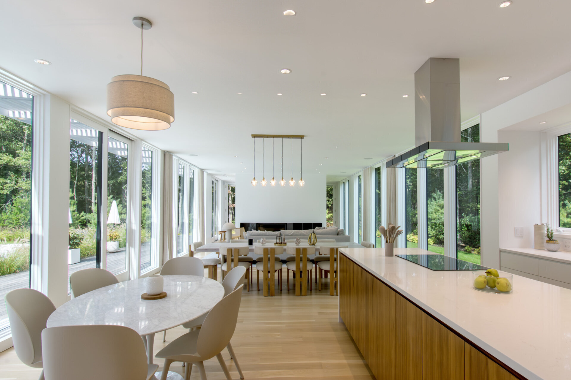 Warm wood tones and modern cabinetry bring a clean yet inviting atmosphere to this light-filled kitchen.