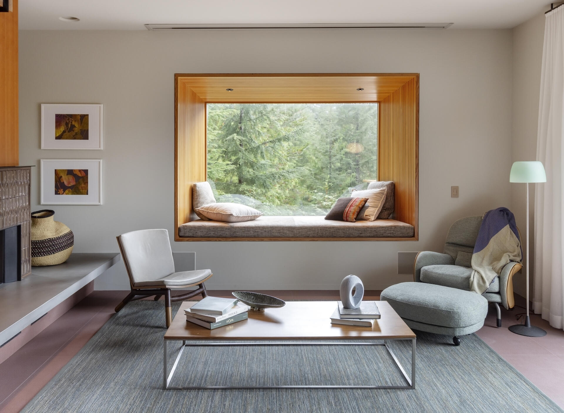 A Douglas fir-lined window seat extends into the forest, creating the ultimate cozy reading nook with mountain views.