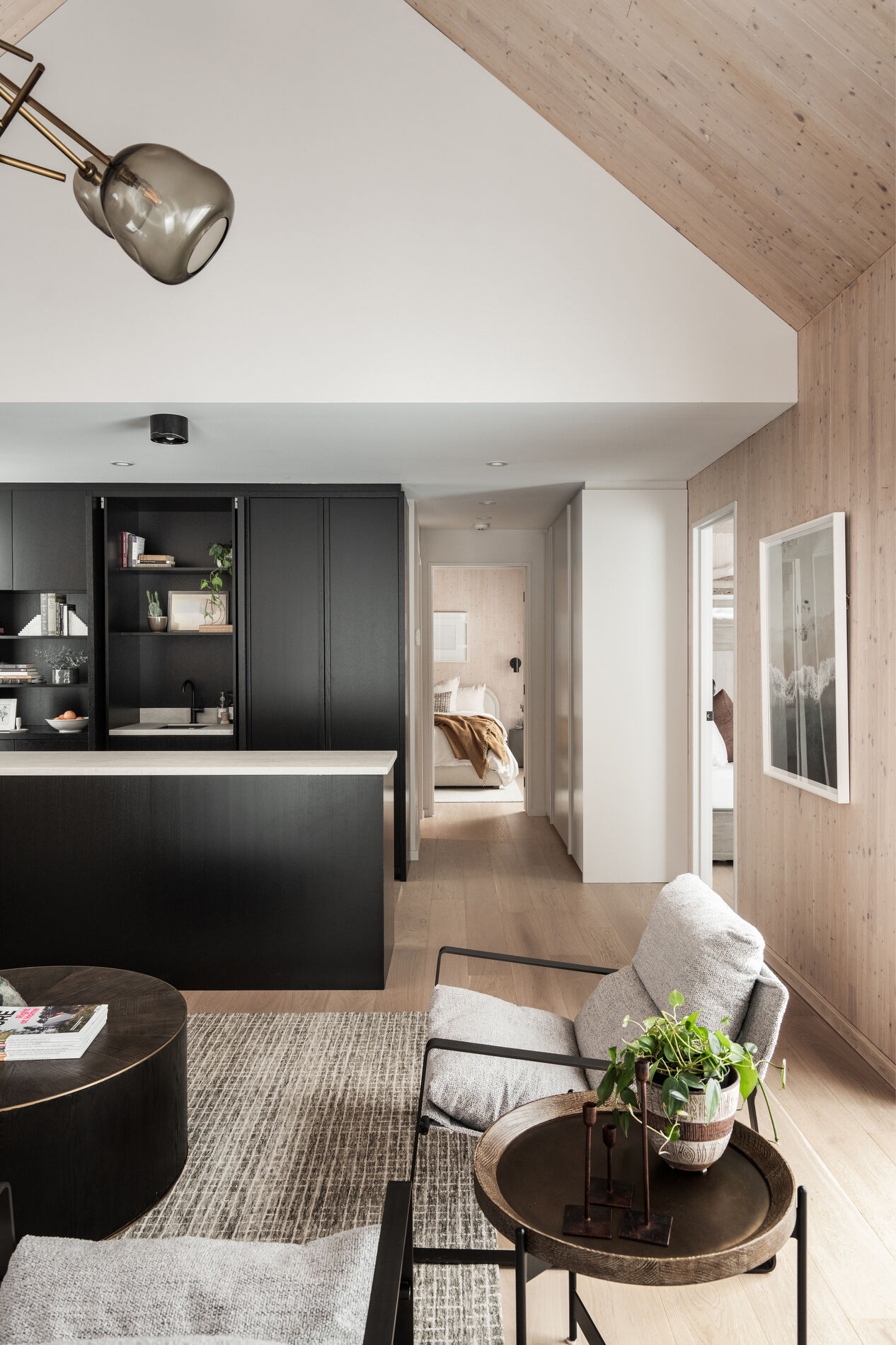 Compact family living units with private kitchens, bunk rooms, and timber interiors, designed in a modern mountain style.